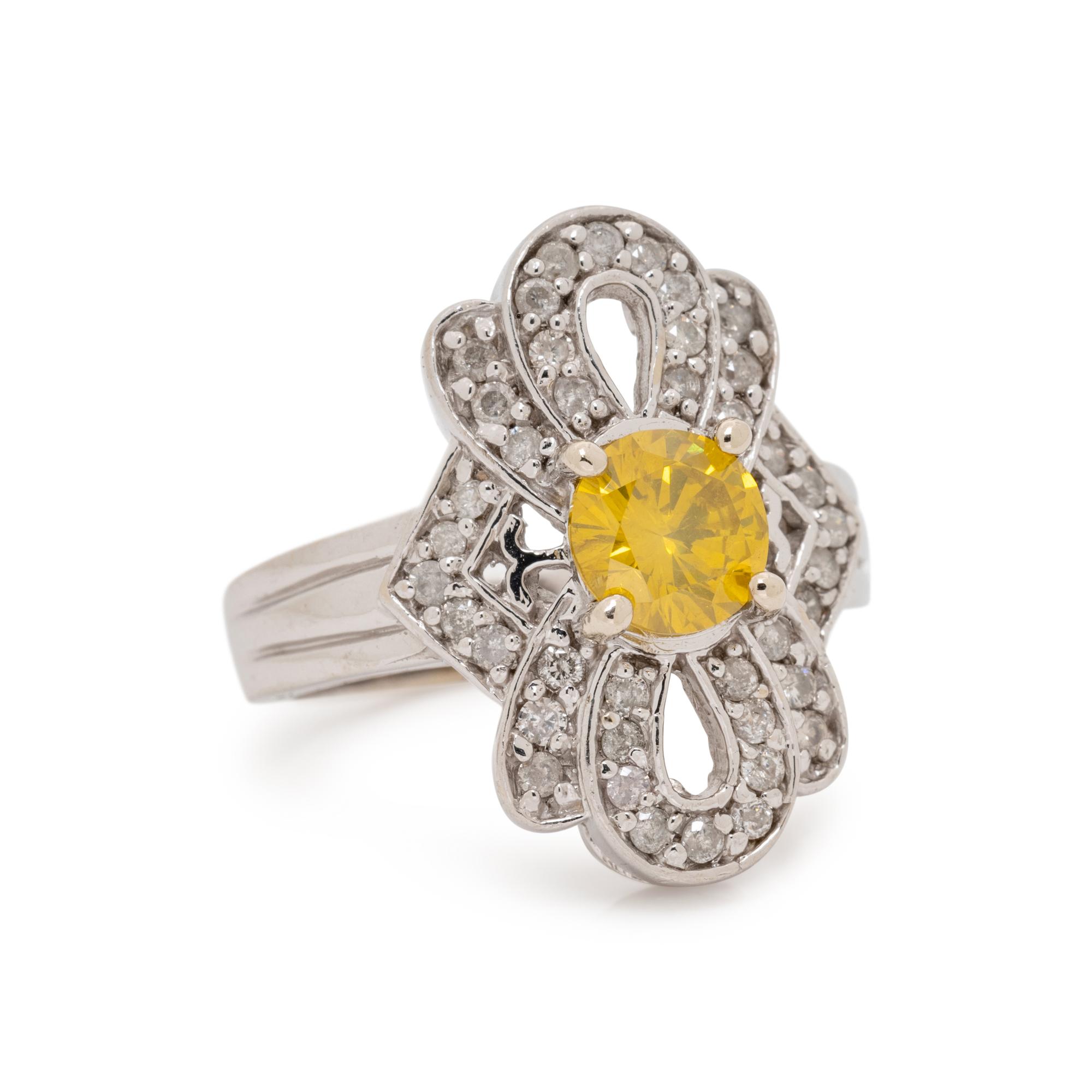 WHITE GOLD, TREATED YELLOW DIAMOND AND DIAMOND RING