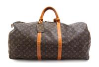 A Louis Vuitton Monogram Canvas Duffle Bag, 24" x 12" x 10.5".