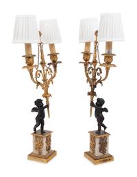 A Pair of French Gilt Metal and Marble Figural Two-Light Candelabra