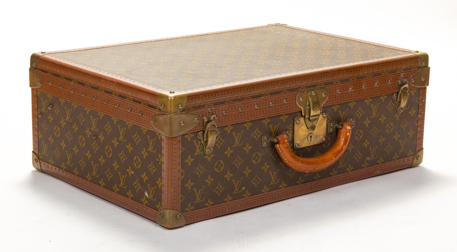 A Louis Vuitton Monogram Canvas Alzer Suitcase, 16" H x 23.5"W x 8.25"D; Handle drop: 2".