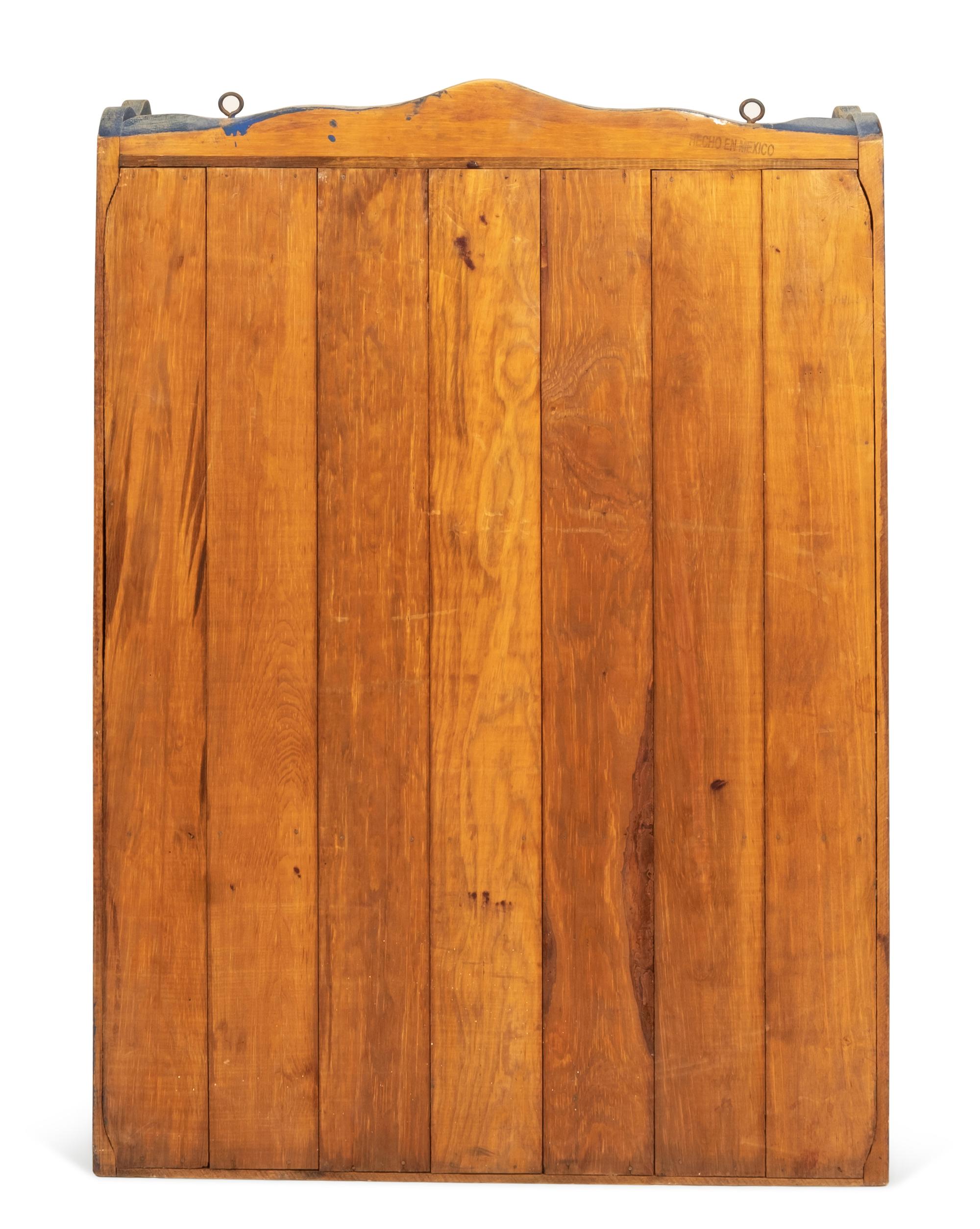A Rustic Hanging Cabinet in Old Blue Paint