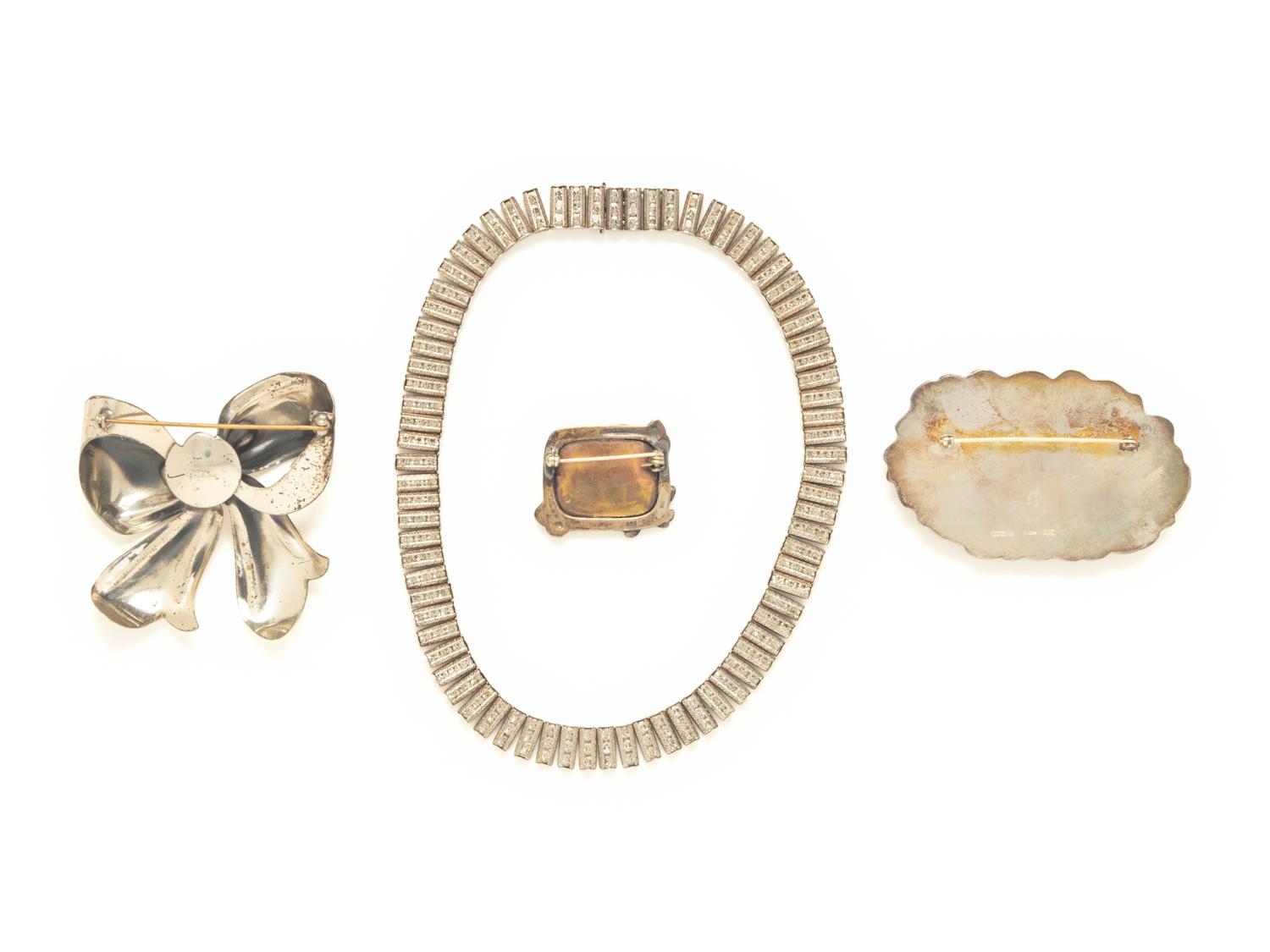 FOUR PIECES OF STERLING SILVER JEWELRY, INCLUDING THREE BROOCHES AND A NECKLACE