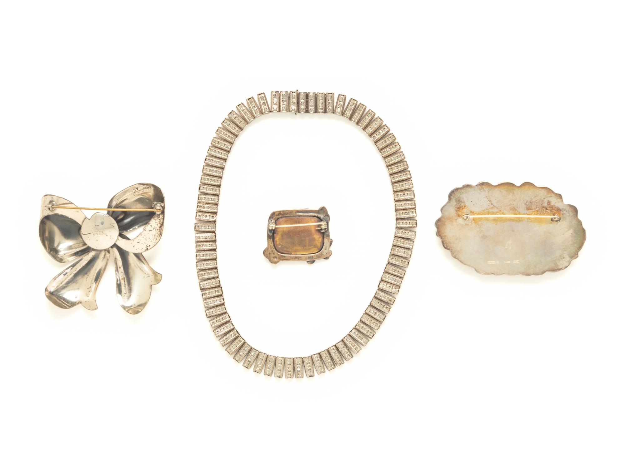 FOUR PIECES OF STERLING SILVER JEWELRY, INCLUDING THREE BROOCHES AND A NECKLACE