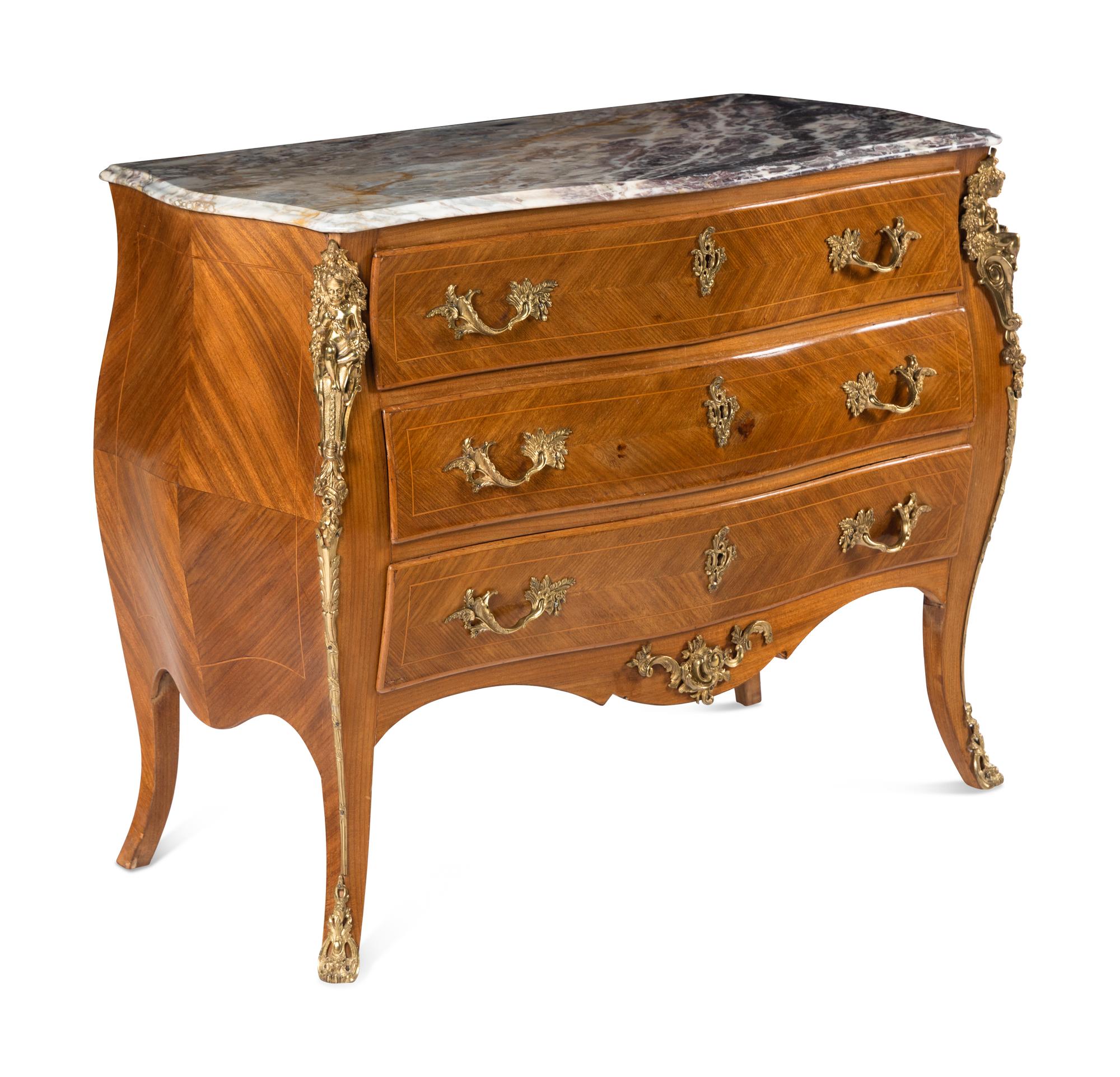 A Régence Style Gilt Metal Mounted Marble-Top Commode