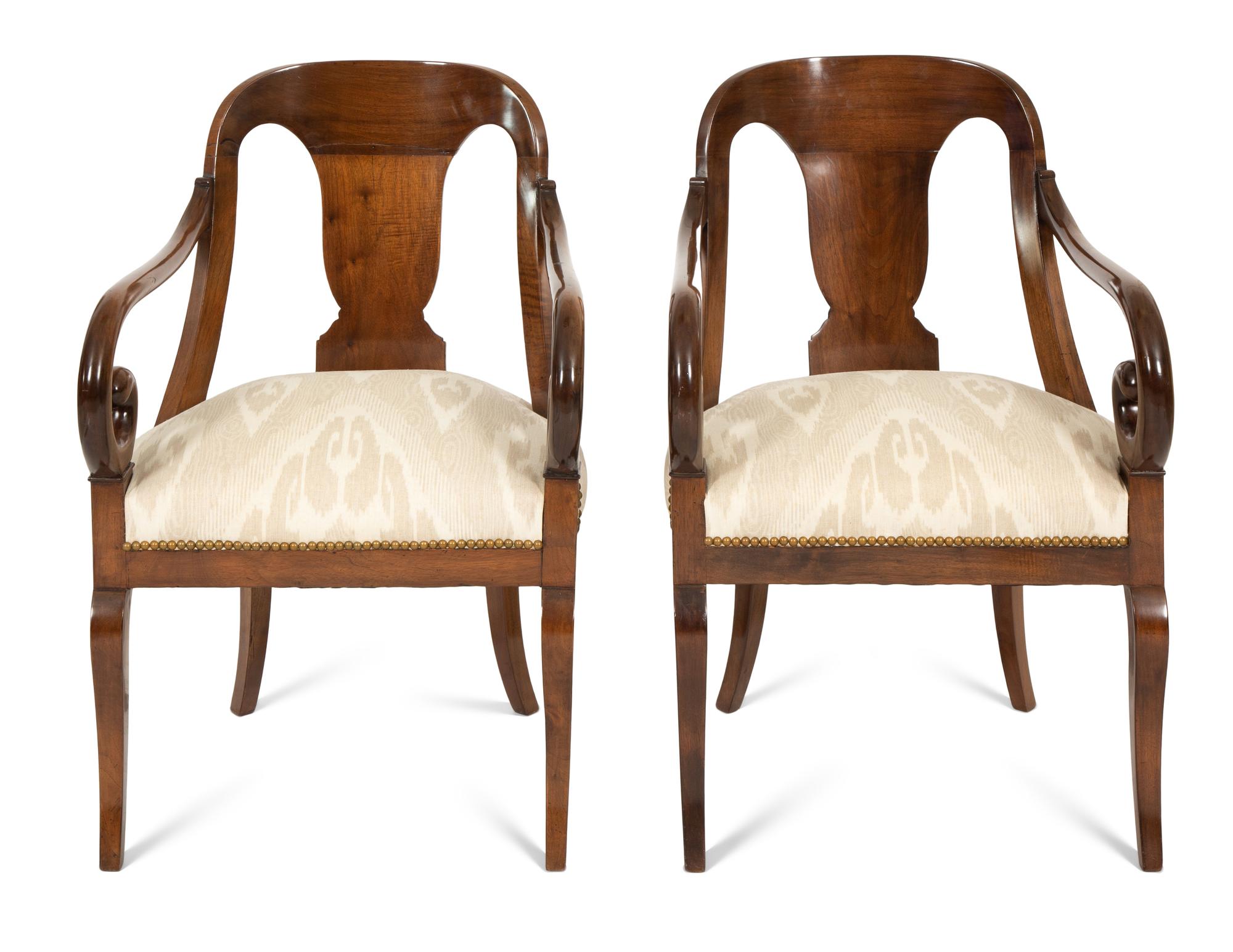 A Pair of Empire Style Mahogany Arm Chairs