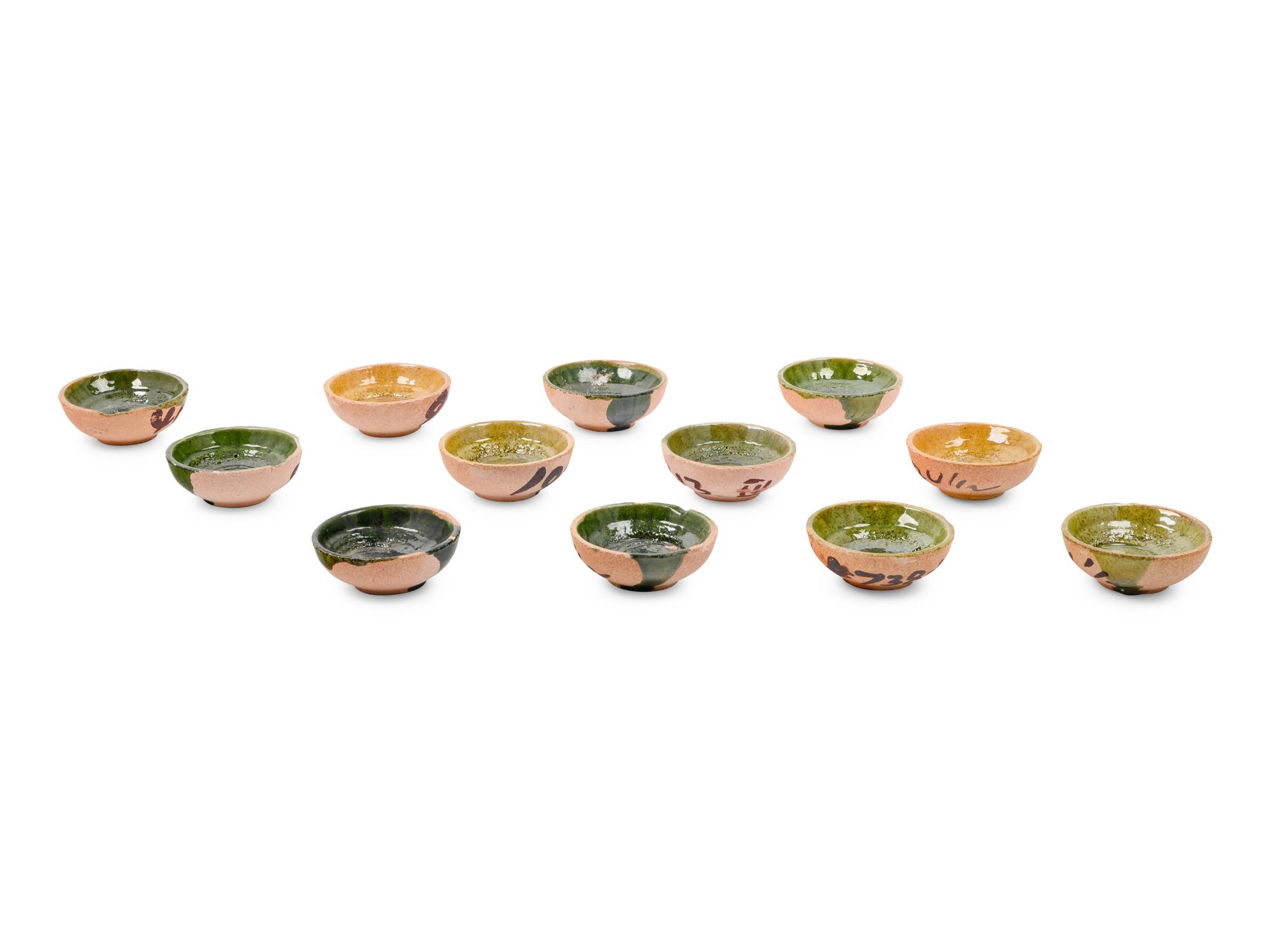 A Set of Forty-Six Glazed Pottery Bowls