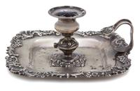 An American Silver Candle Holder, Howard & Co., New York, NY, 19th Century, having a shell and c-scroll border, loop handle, monogramme