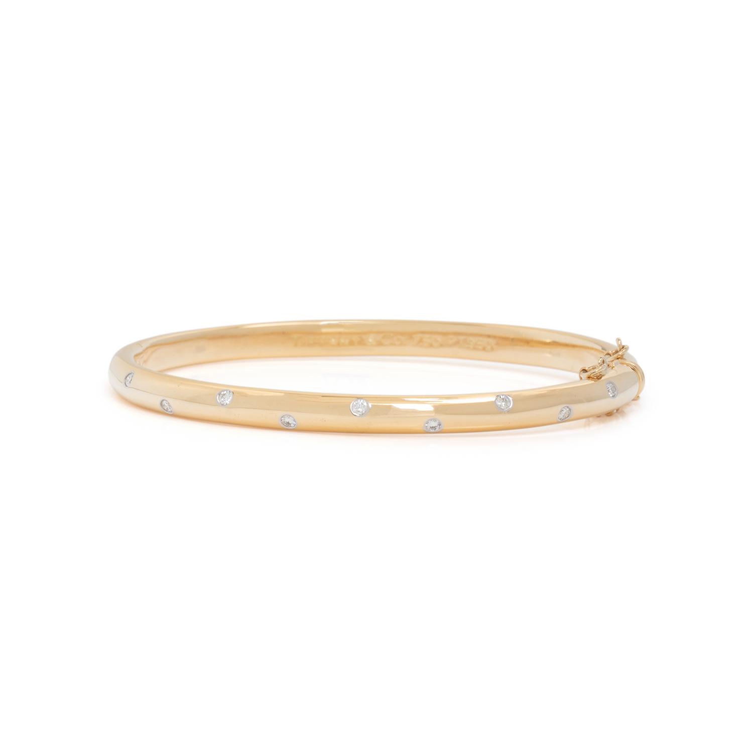 TIFFANY & CO., YELLOW GOLD, PLATINUM AND DIAMOND 'ETOILE' BANGLE BRACELET