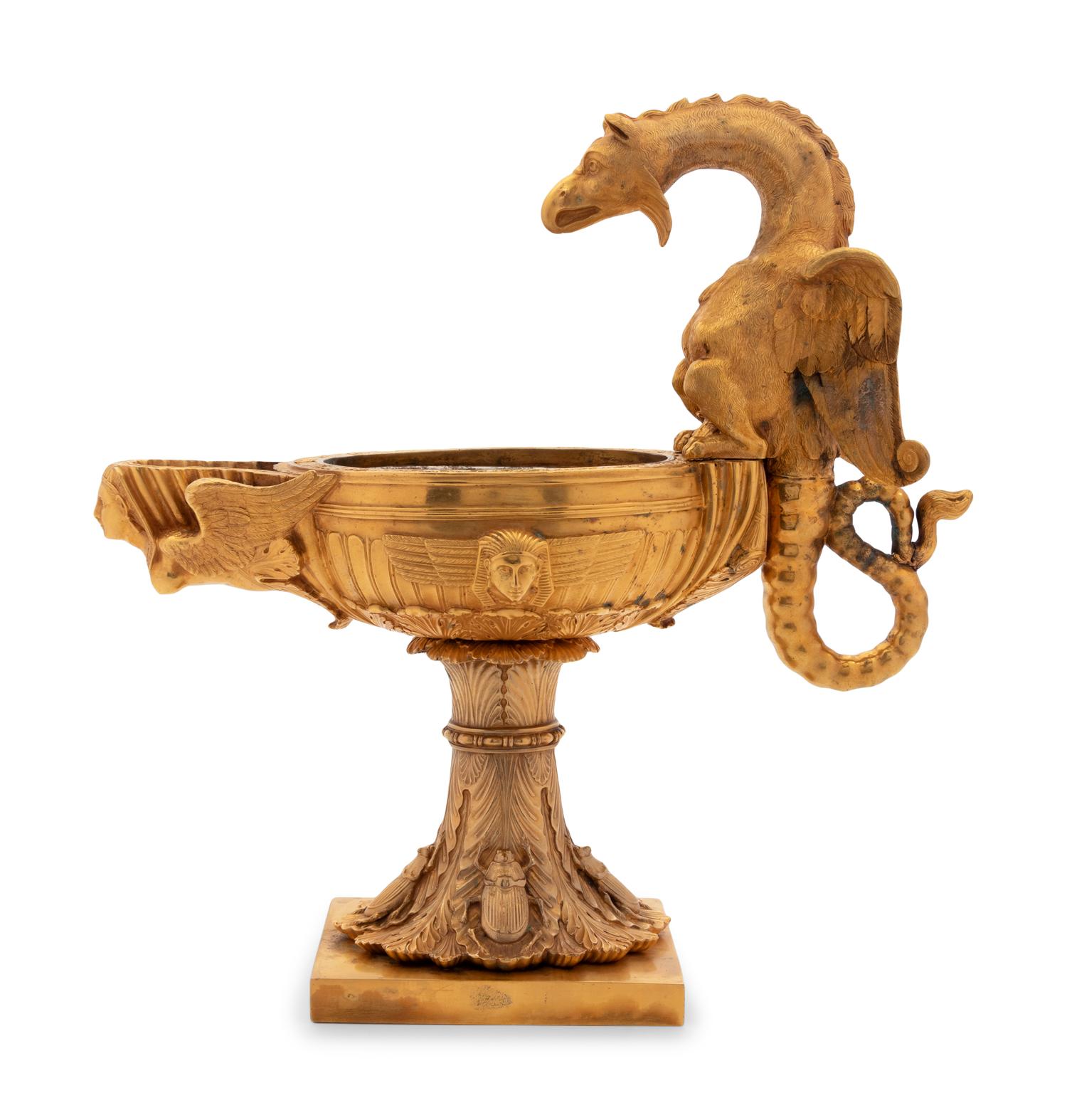 A Continental Gilt Bronze Oil Lamp with a Dragon Handle