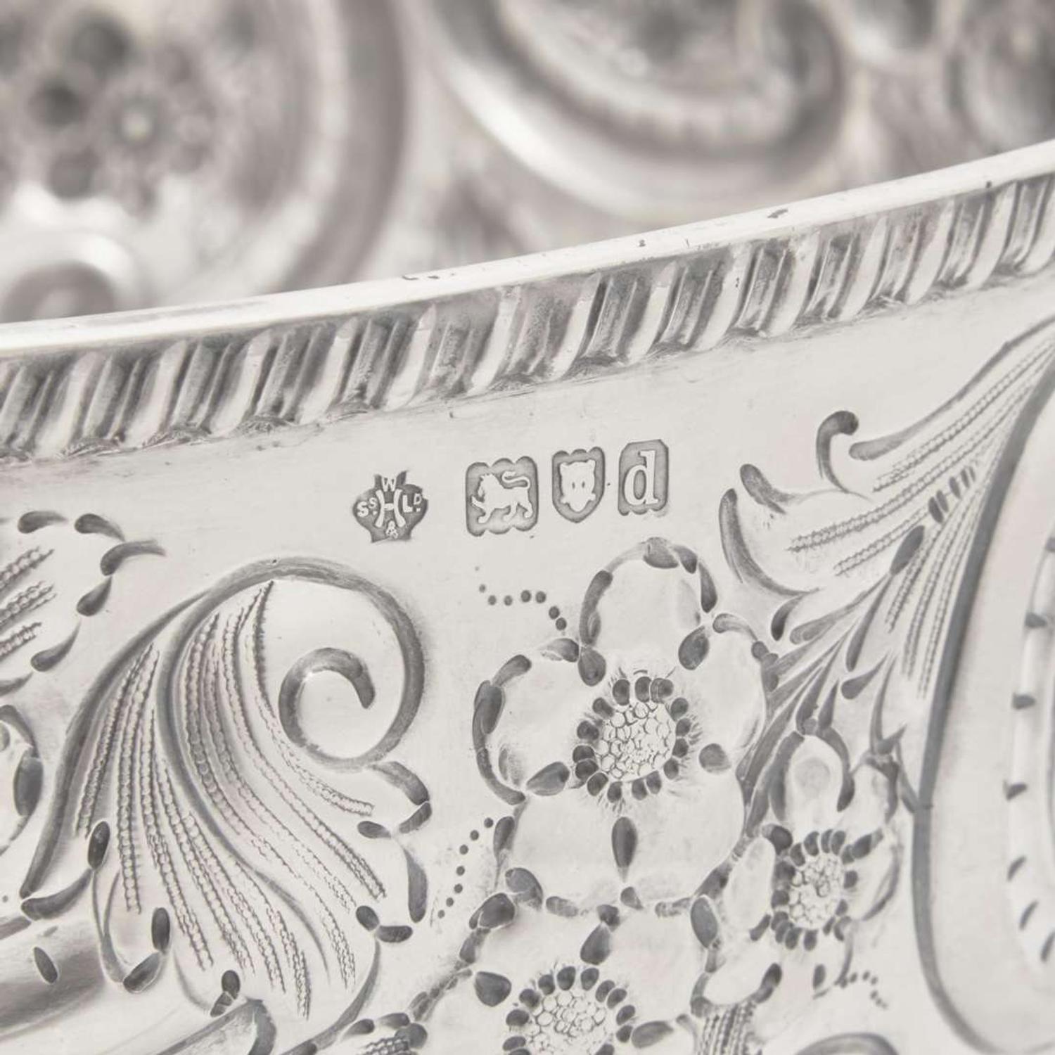 A Victorian sterling silver repoussé punch bowl William Hutton & Sons Ltd., London, 1899