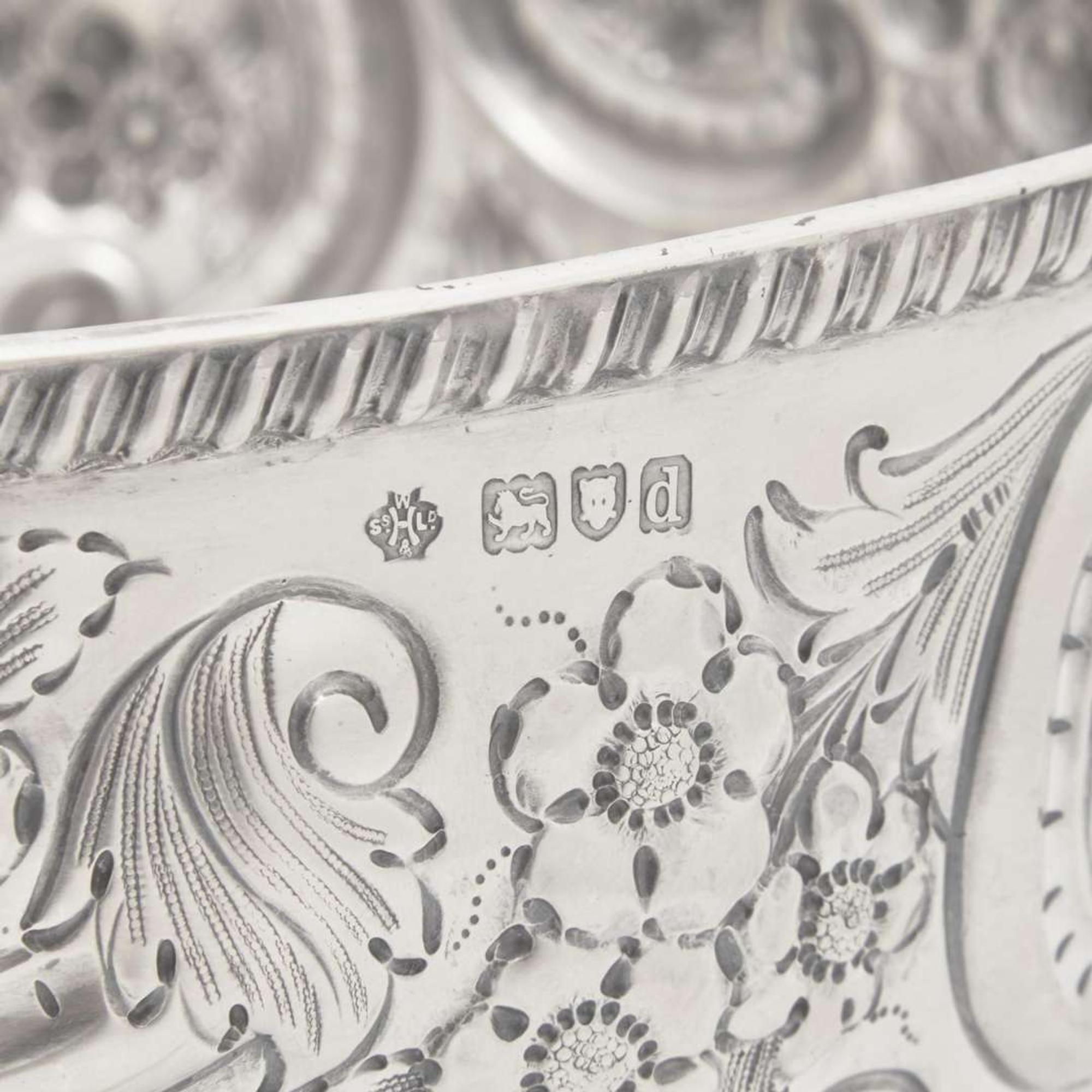 A Victorian sterling silver repoussé punch bowl William Hutton & Sons Ltd., London, 1899