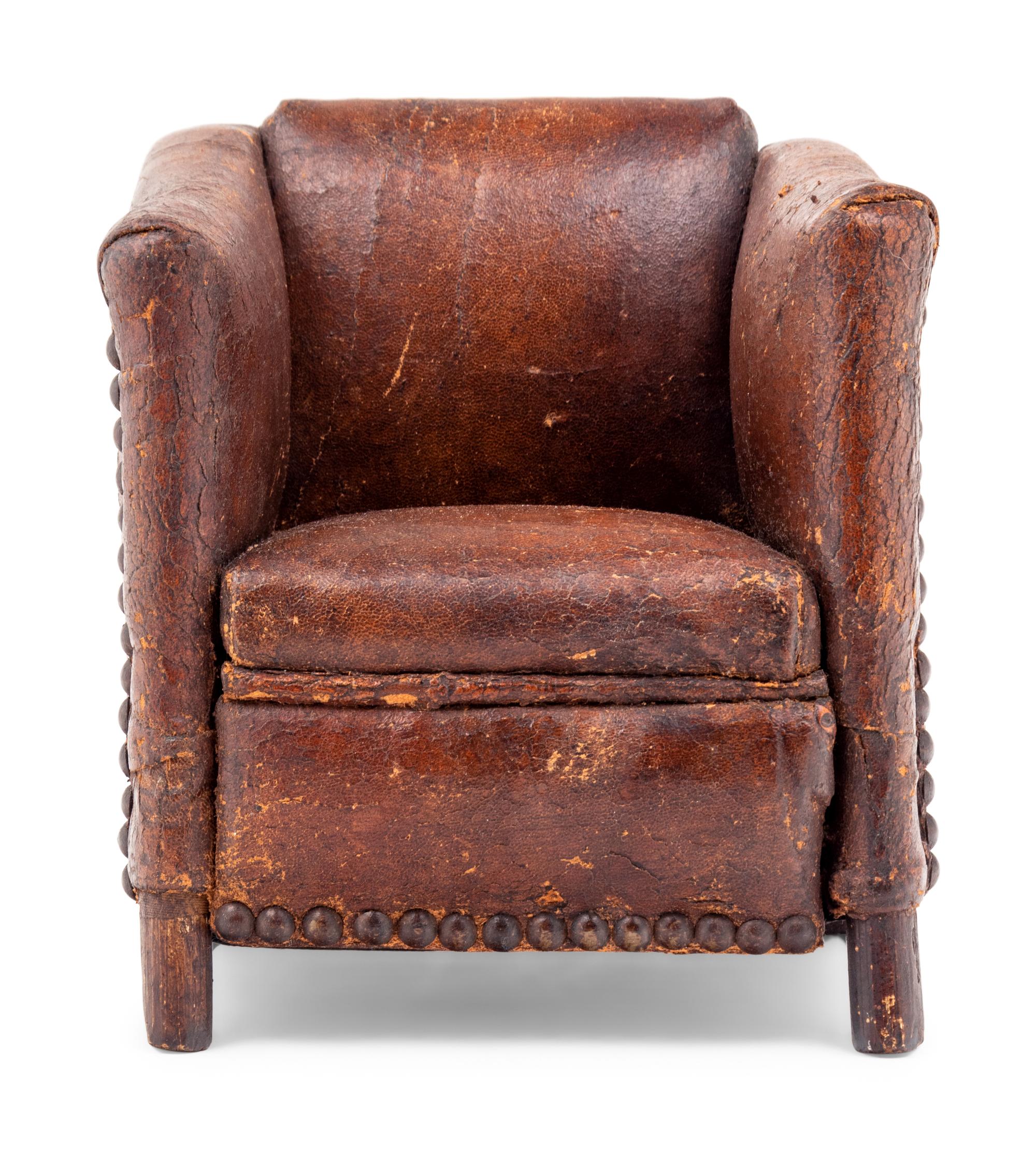 A Diminutive Leather Upholstered Club Chair