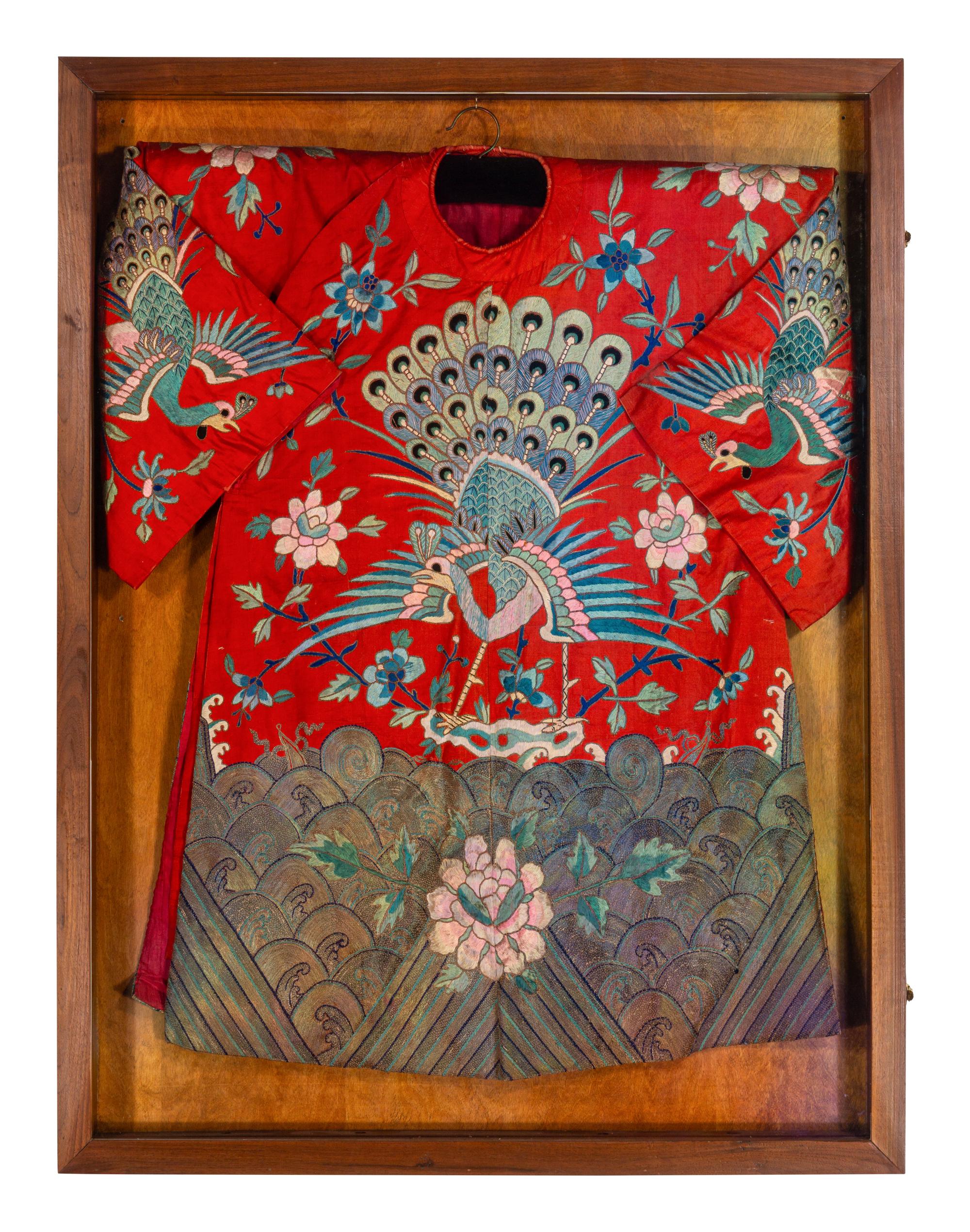 A Chinese Red Ground and Embroidered Silk 'Peacock' Robe