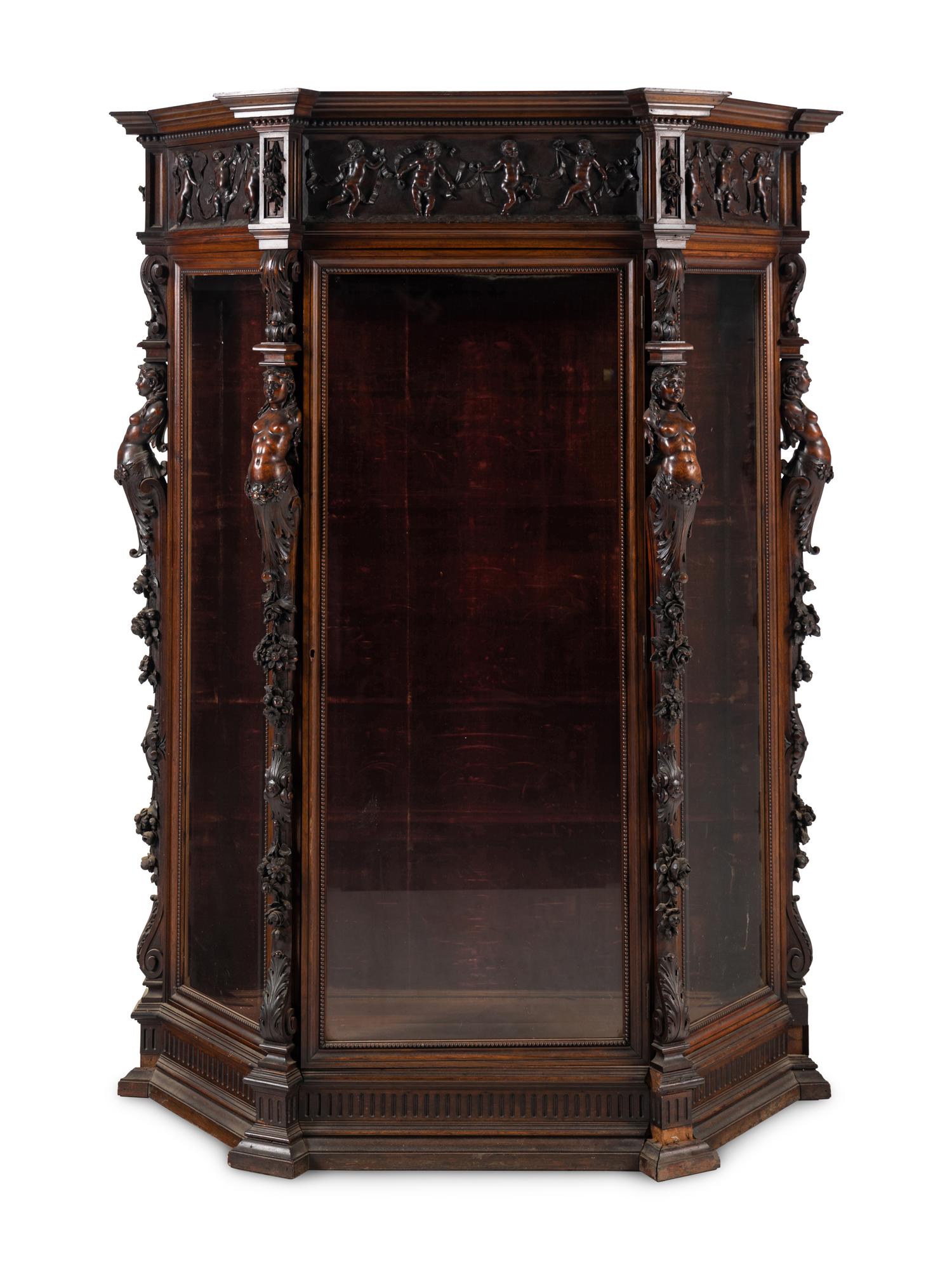 An Italian Renaissance Revival Carved Walnut Cabinet
