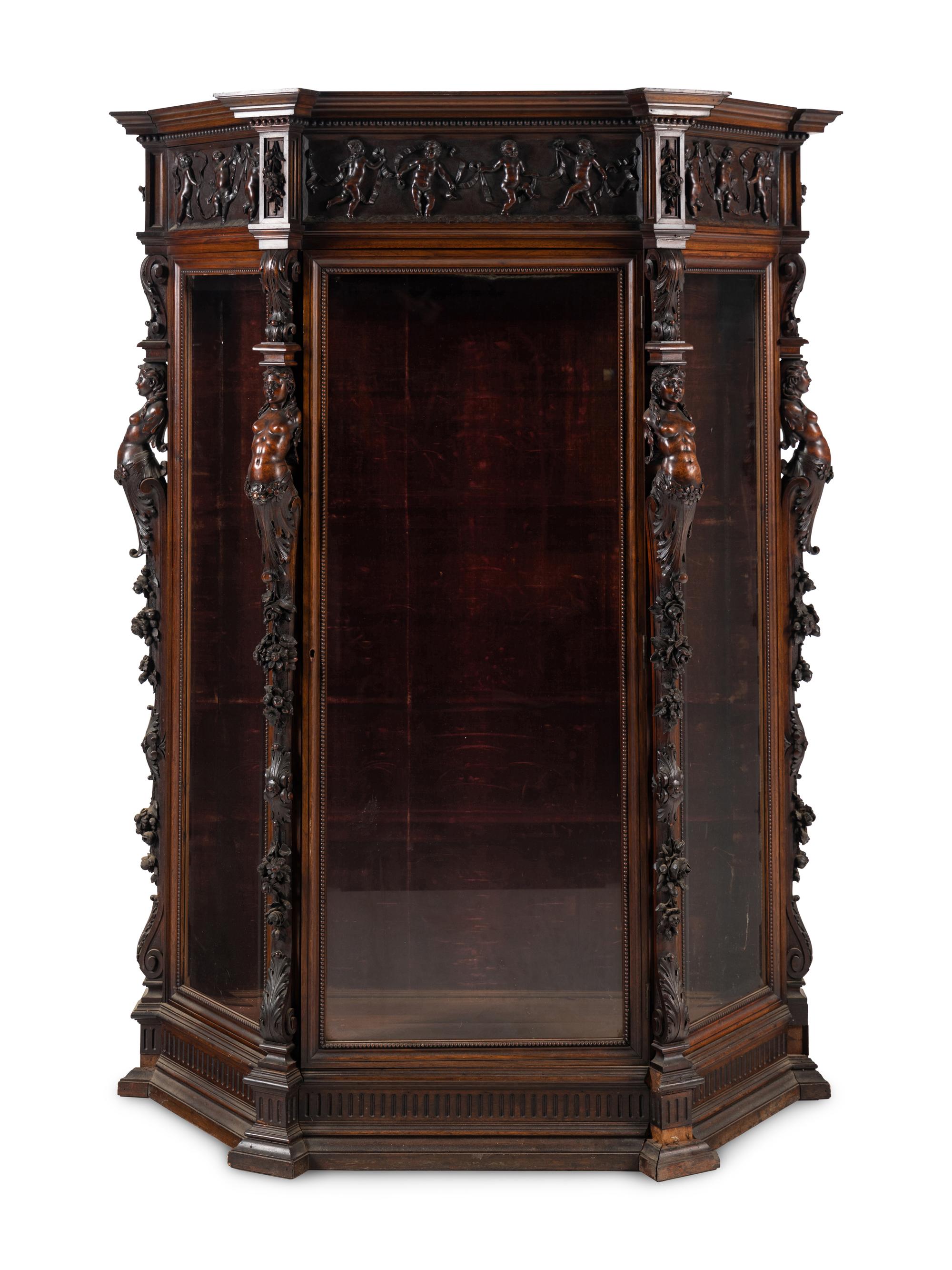 An Italian Renaissance Revival Carved Walnut Cabinet