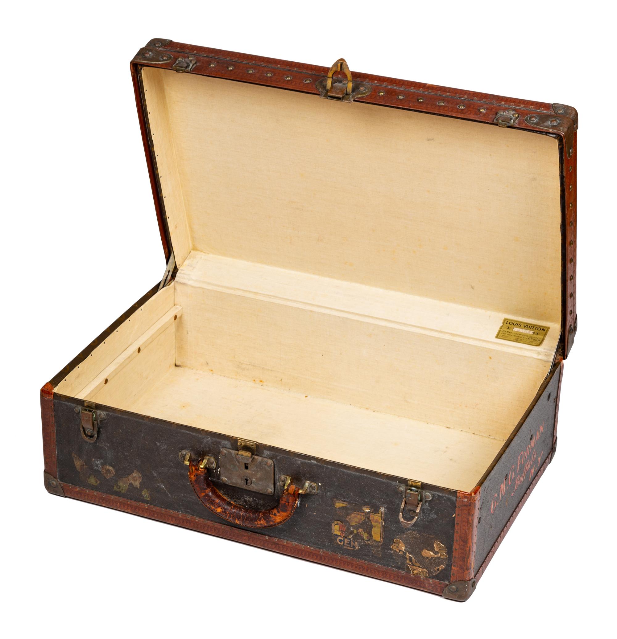 A Louis Vuitton Monogram Canvas Hardsided Suitcase, 15.5" H x 23.75" W x 8" D; Handle drop: 2.25".