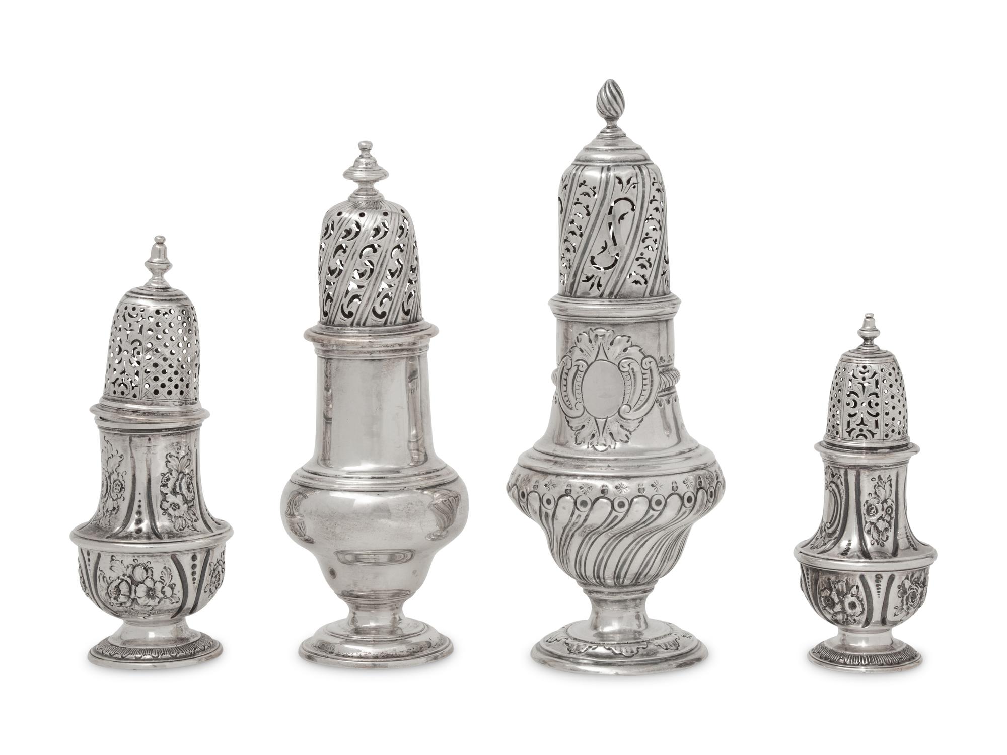 A Group of Four English Silver Casters and Muffineers
