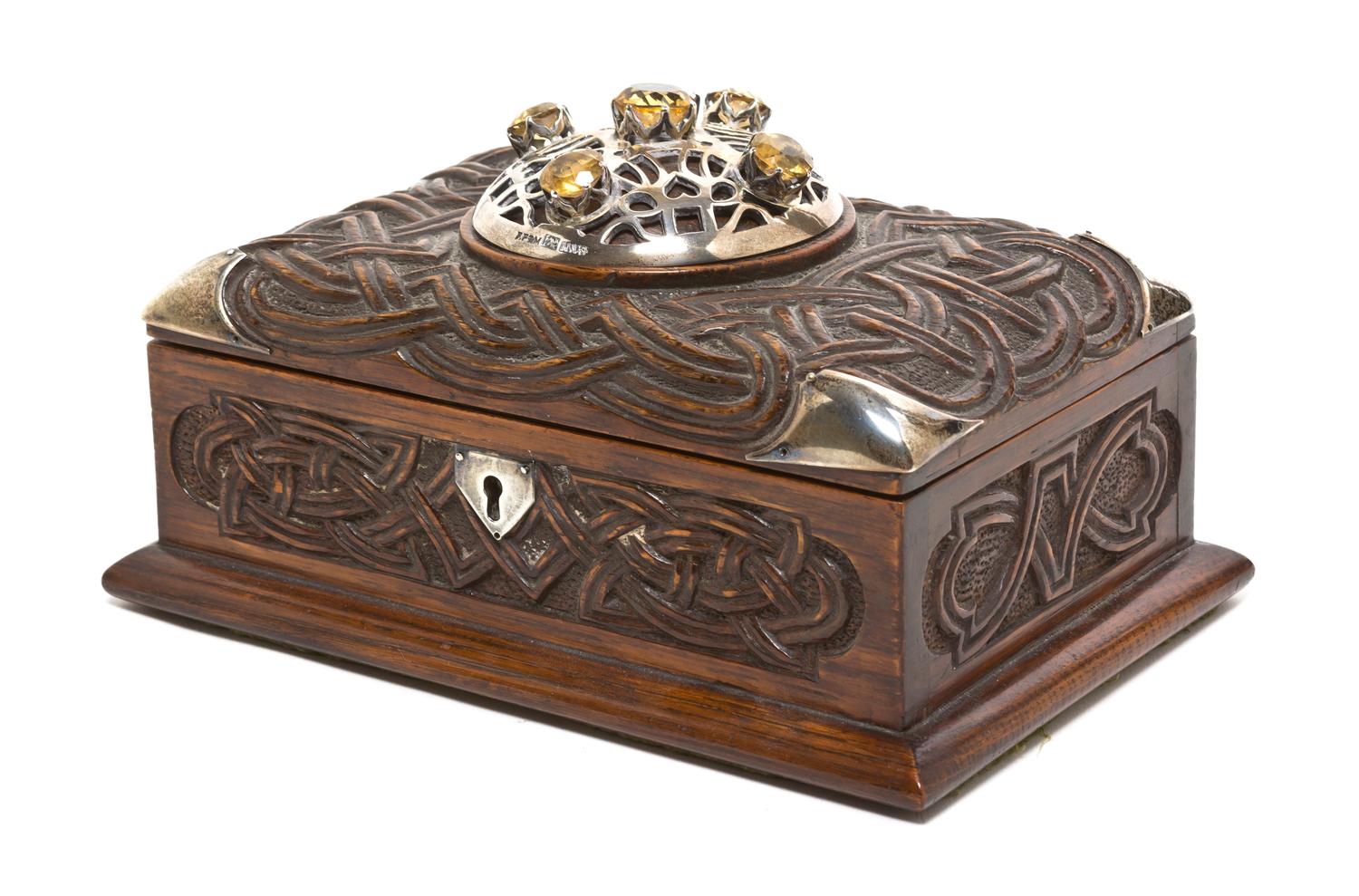 A Scottish Silver Mounted Carved Oak Table Casket, Height 5 1/2 x width 8 1/4 x depth 5 1/2 inches.