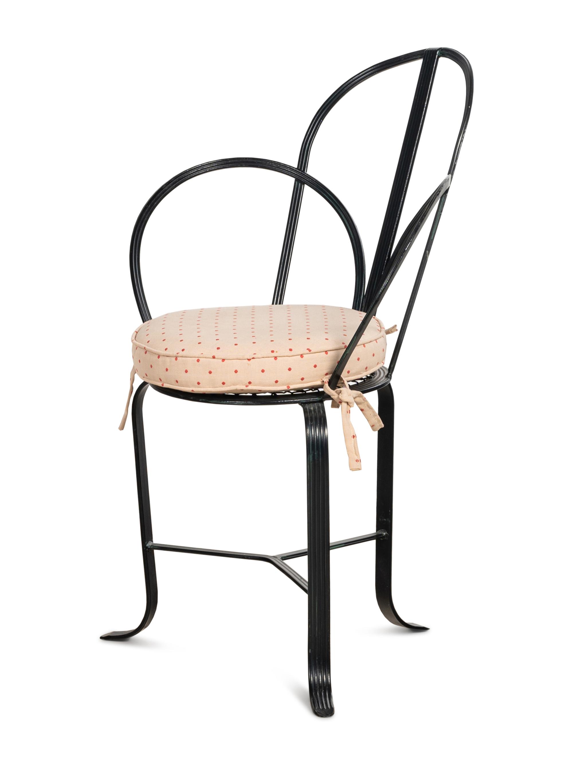 A Set of Four Steel Café Chairs