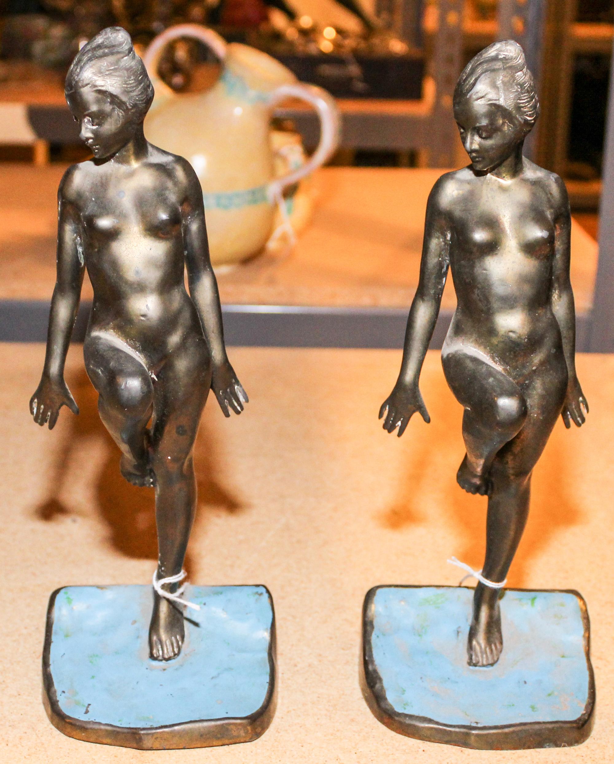 A Pair of Art Deco Cast Metal Figural Bookends Height 10 3/4 inches. — RONSON
