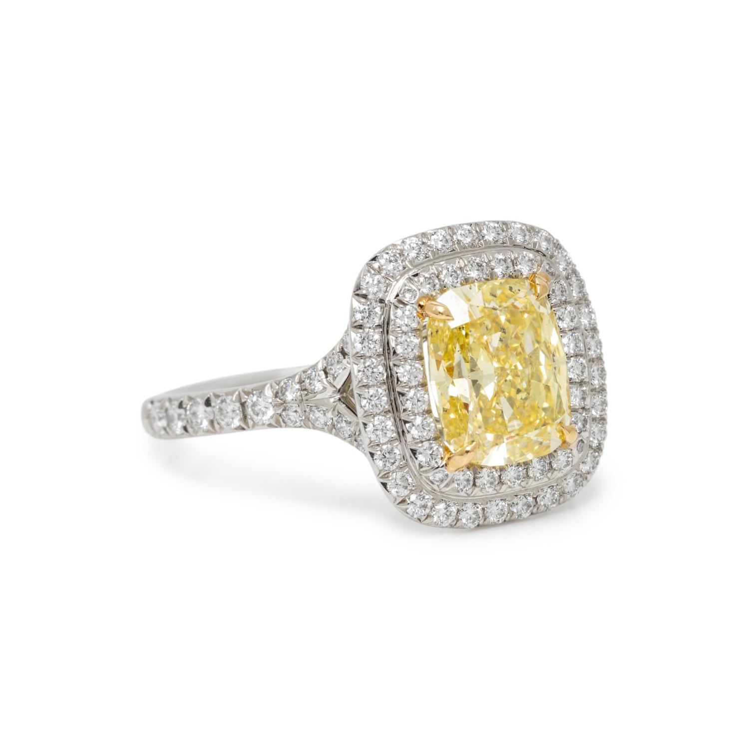 TIFFANY & CO., FANCY INTENSE YELLOW DIAMOND, DIAMOND, AND PLATINUM 'SOLESTE' RING