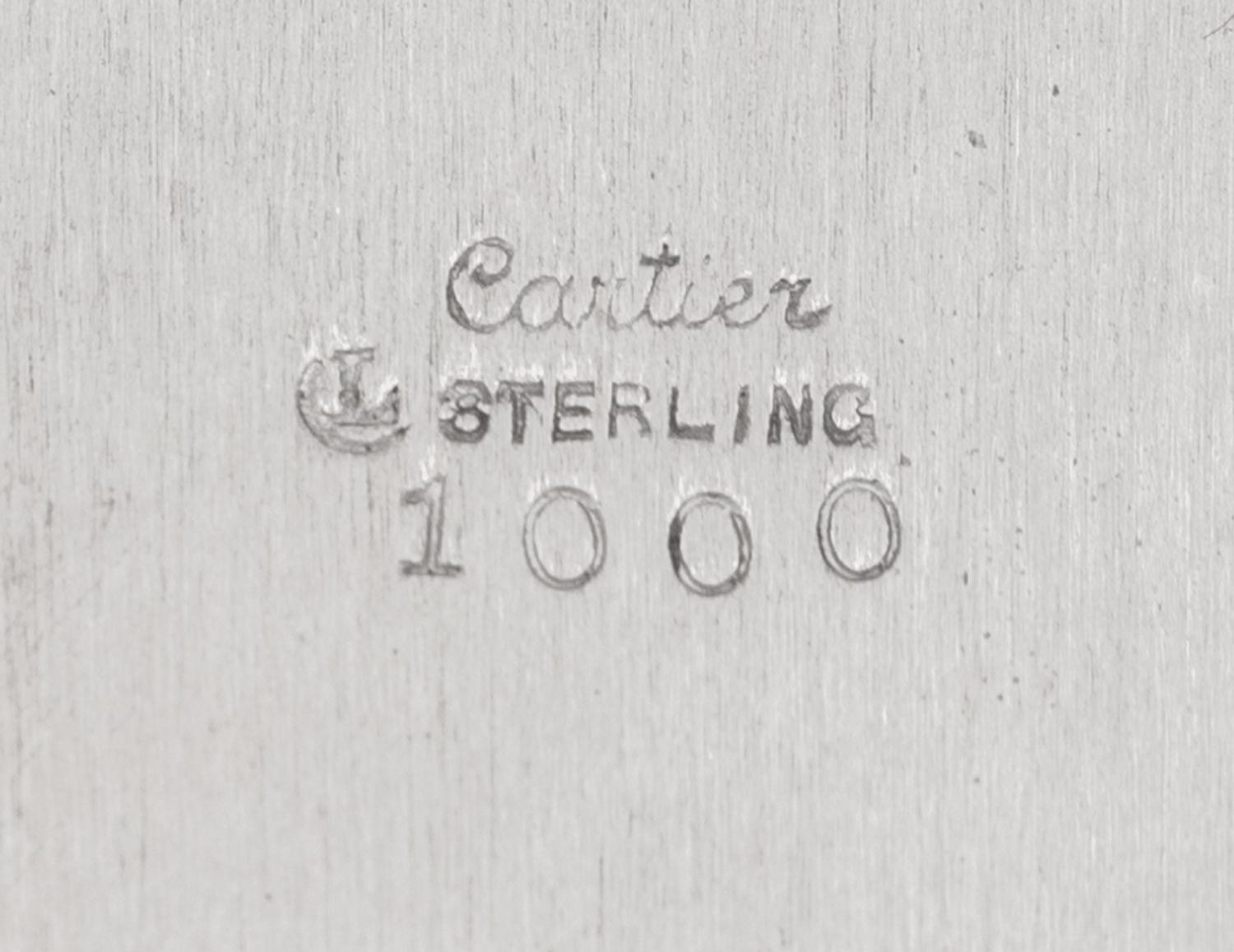 A Set of Eleven Cartier Silver Bread Plates