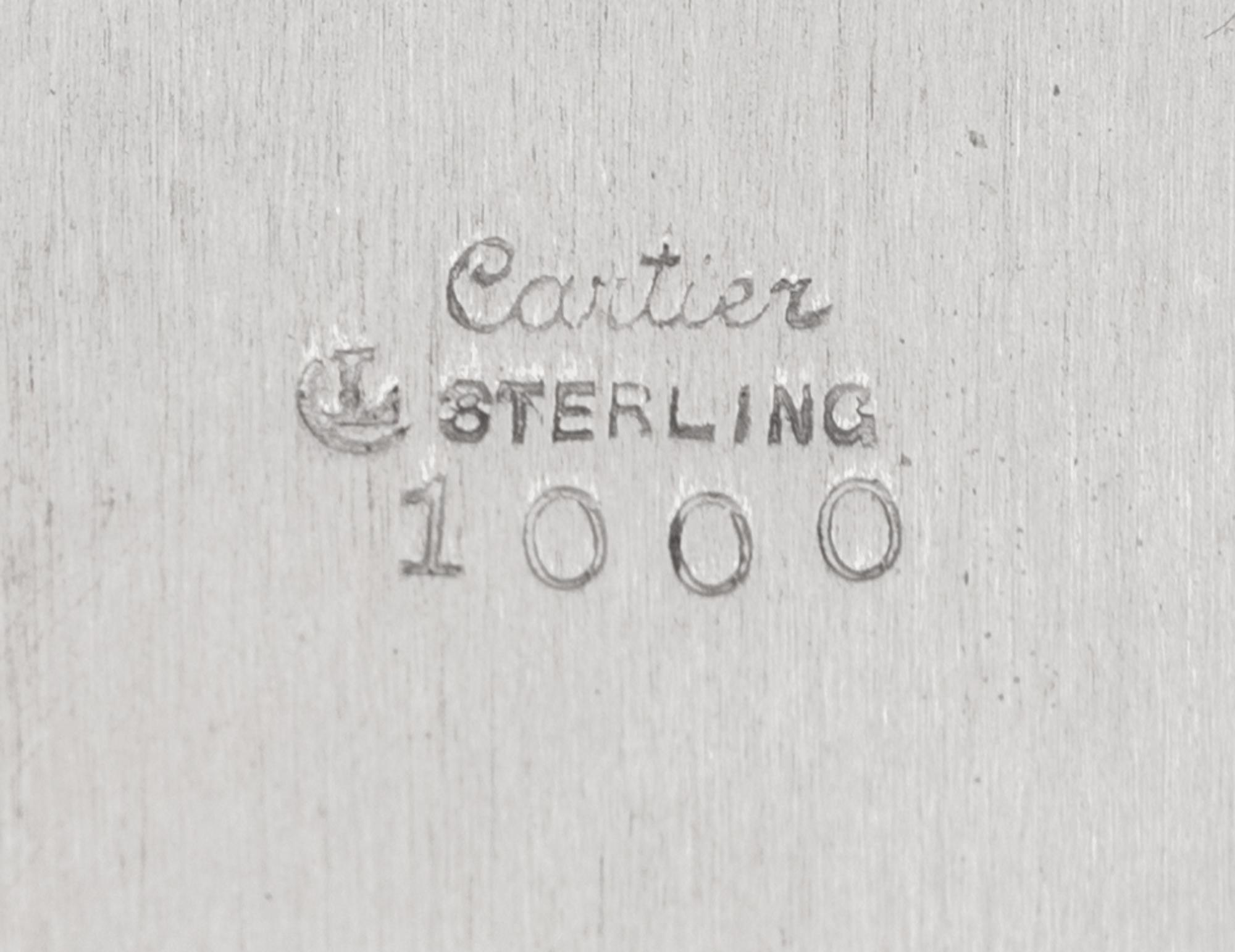 A Set of Eleven Cartier Silver Bread Plates