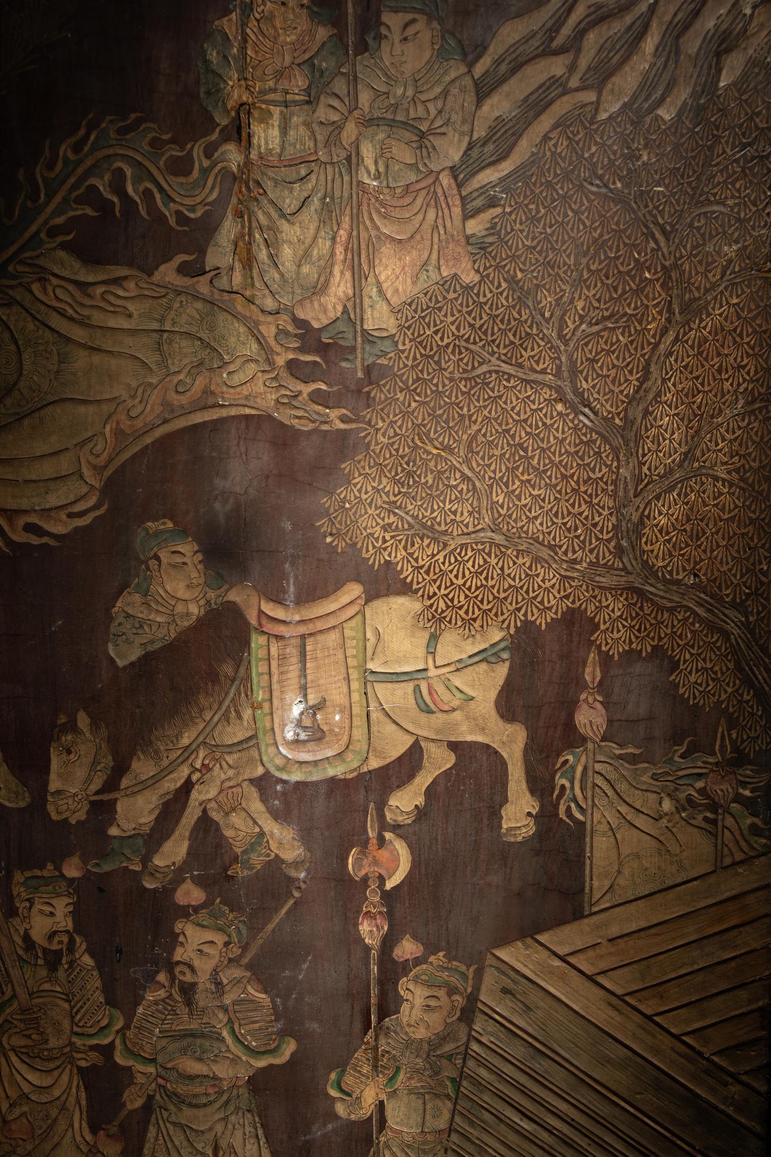 A Coromandel Lacquer Eight-Panel Floor Screen