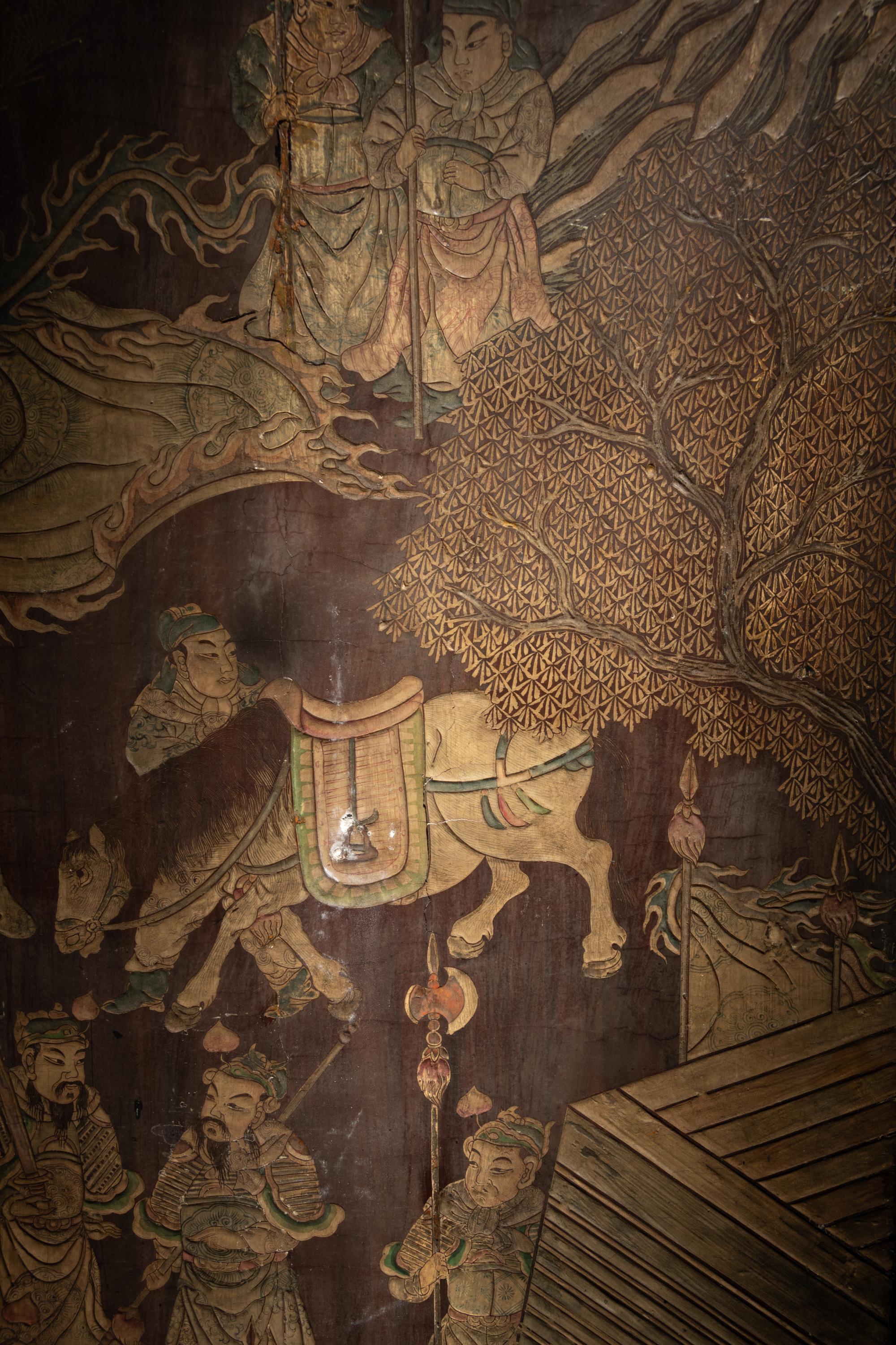 A Coromandel Lacquer Eight-Panel Floor Screen