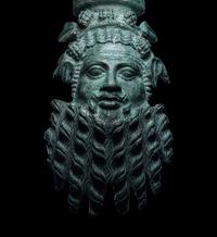 A Roman Bronze Applique Mask in the Form of Silenus