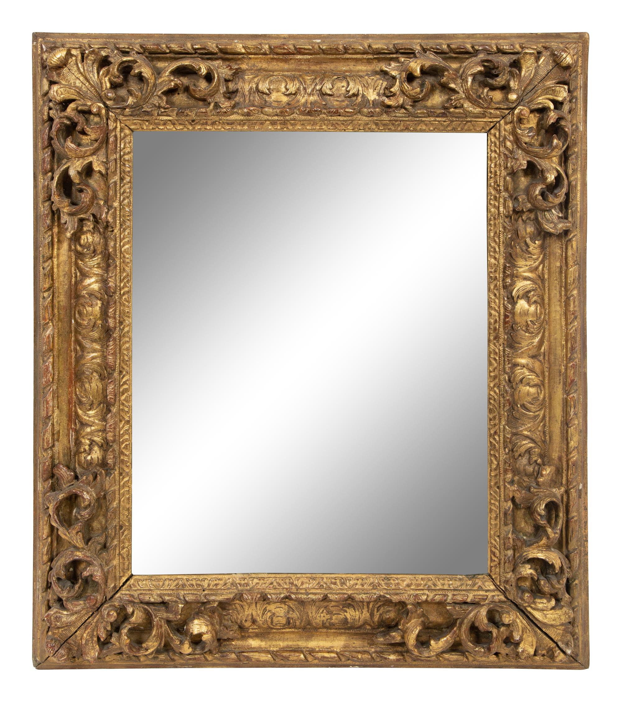 A Continental Carved Giltwood Mirror