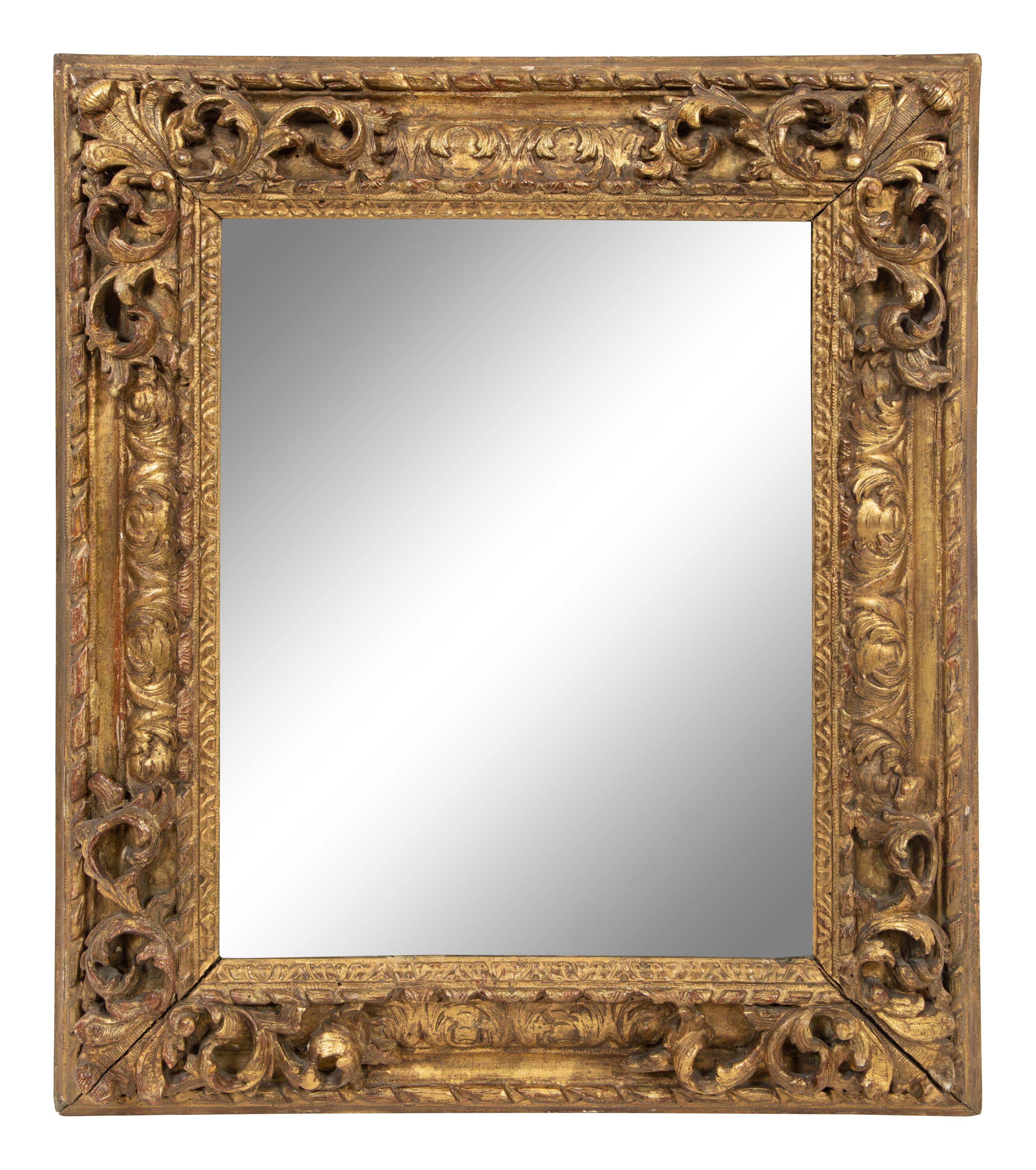 A Continental Carved Giltwood Mirror