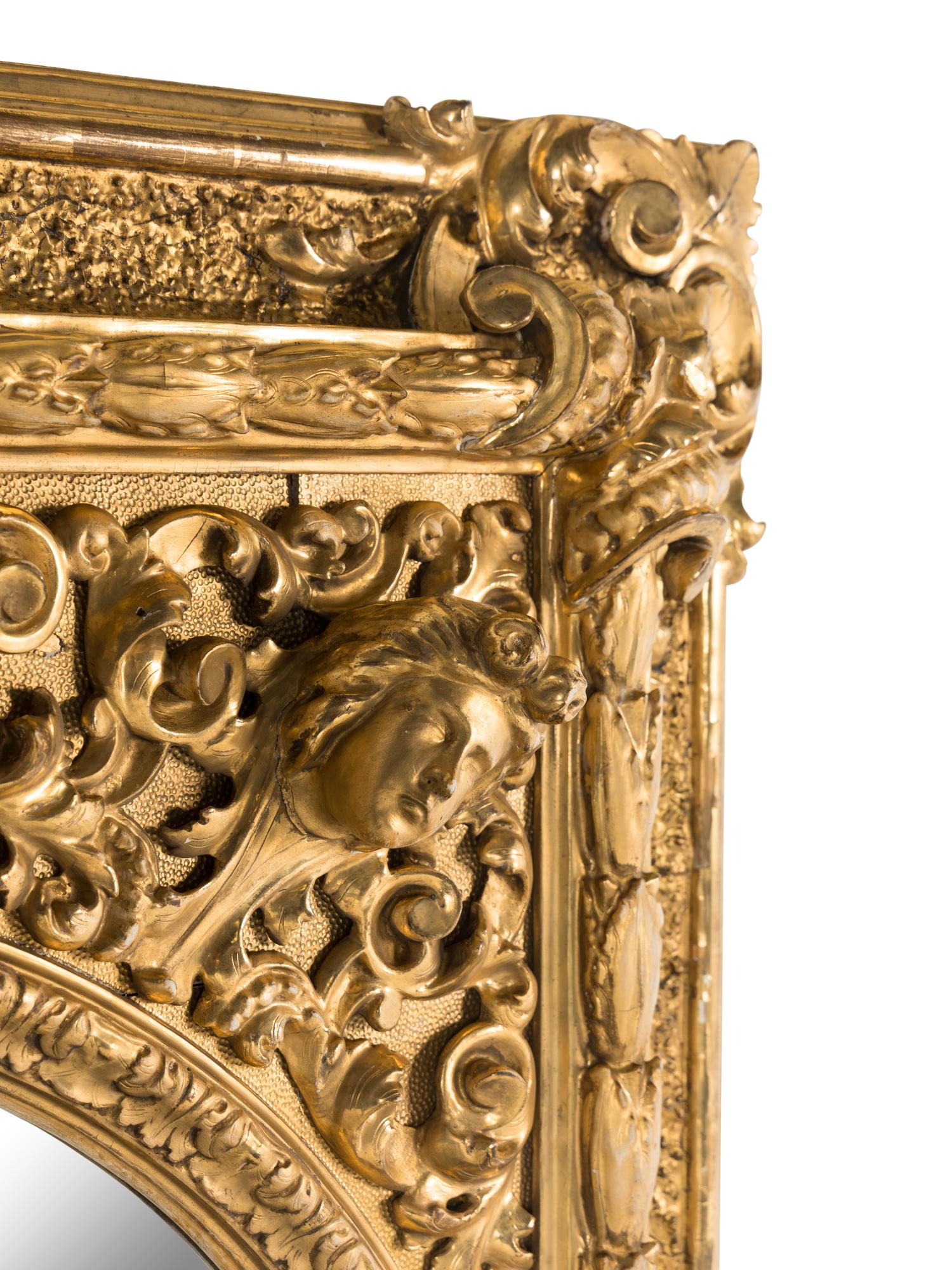 A Baroque Style Giltwood and Gesso Mirror