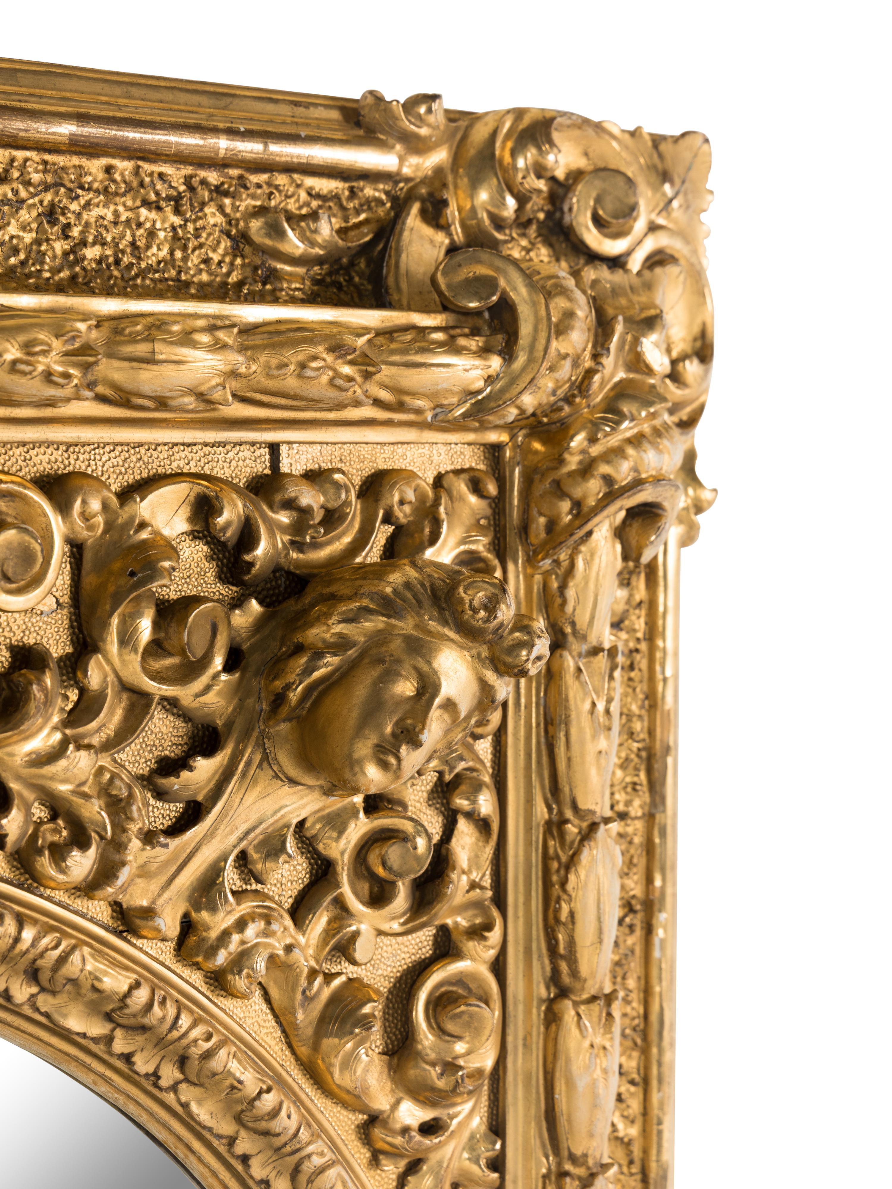 A Baroque Style Giltwood and Gesso Mirror