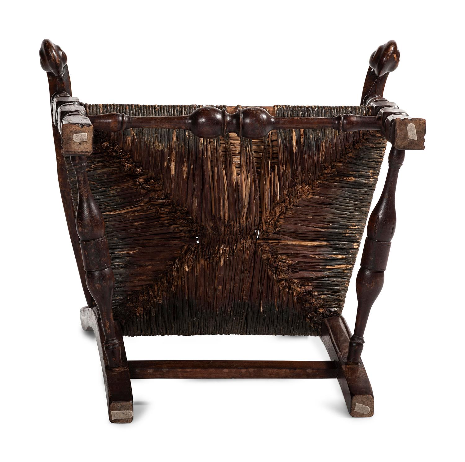 A Queen Anne Mixed Woods Rush-Seat Spanish-Foot Armchair