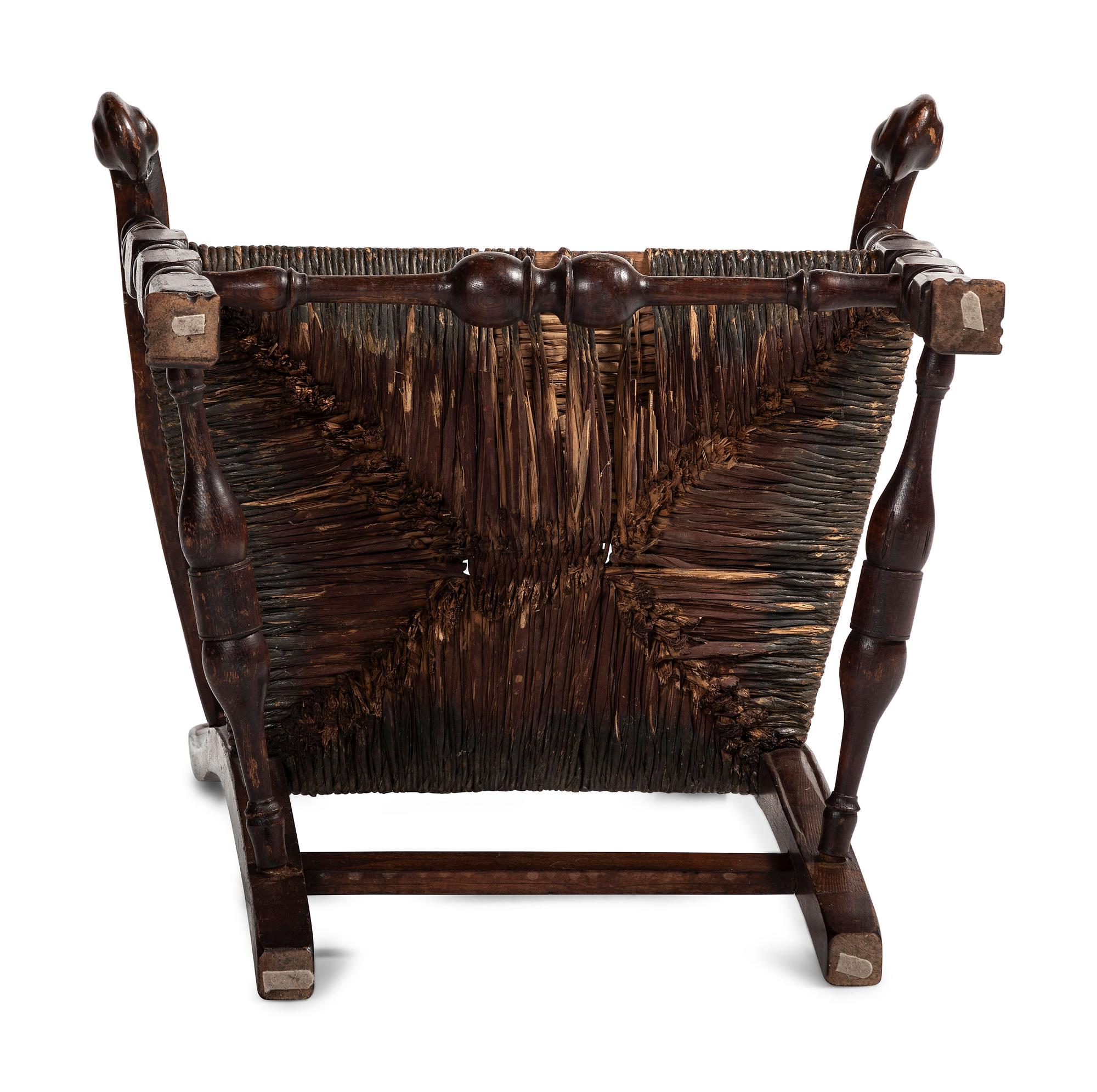 A Queen Anne Mixed Woods Rush-Seat Spanish-Foot Armchair