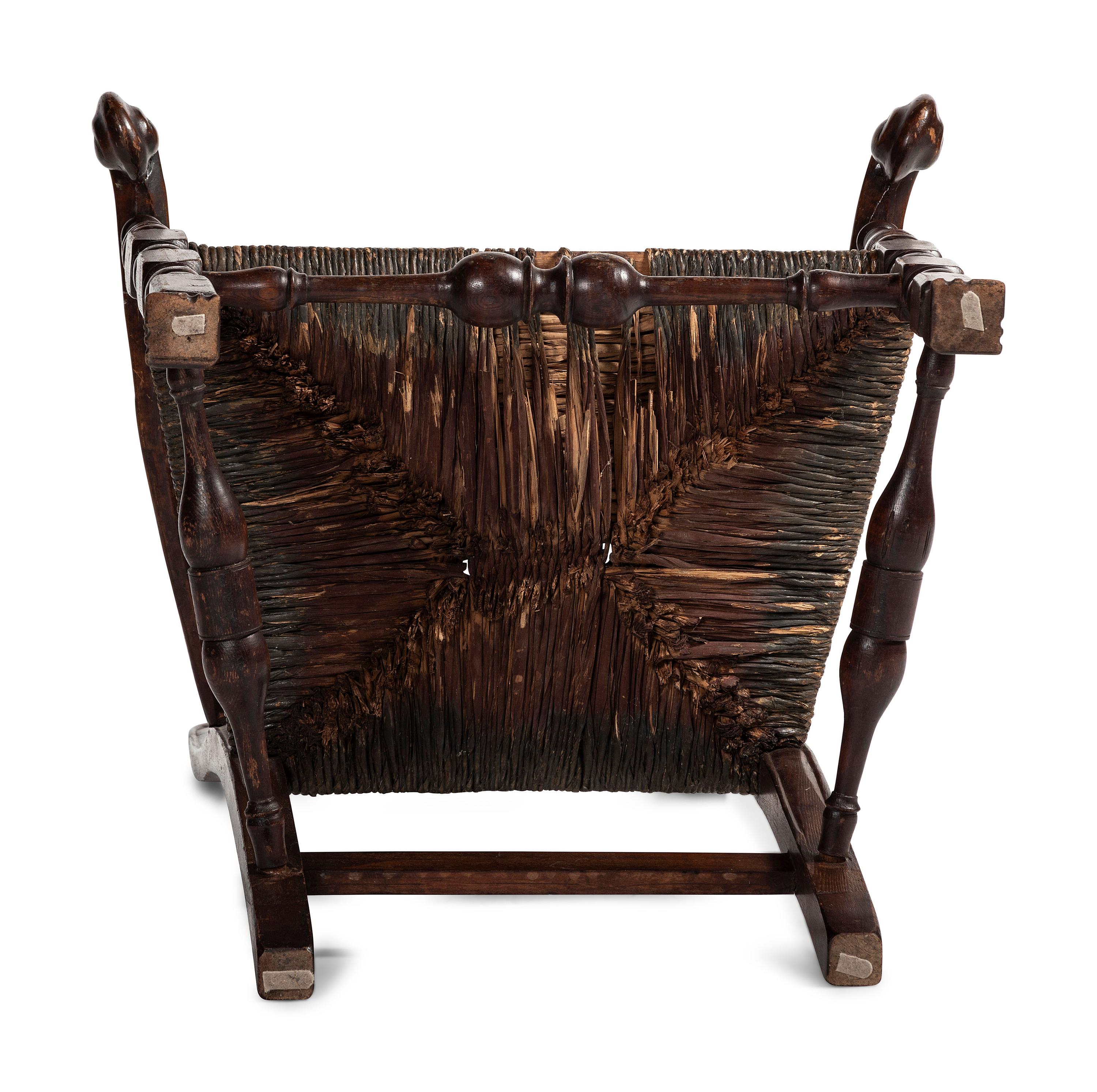 A Queen Anne Mixed Woods Rush-Seat Spanish-Foot Armchair