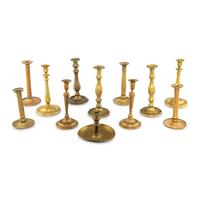 A Collection of Twelve Brass Candlesticks