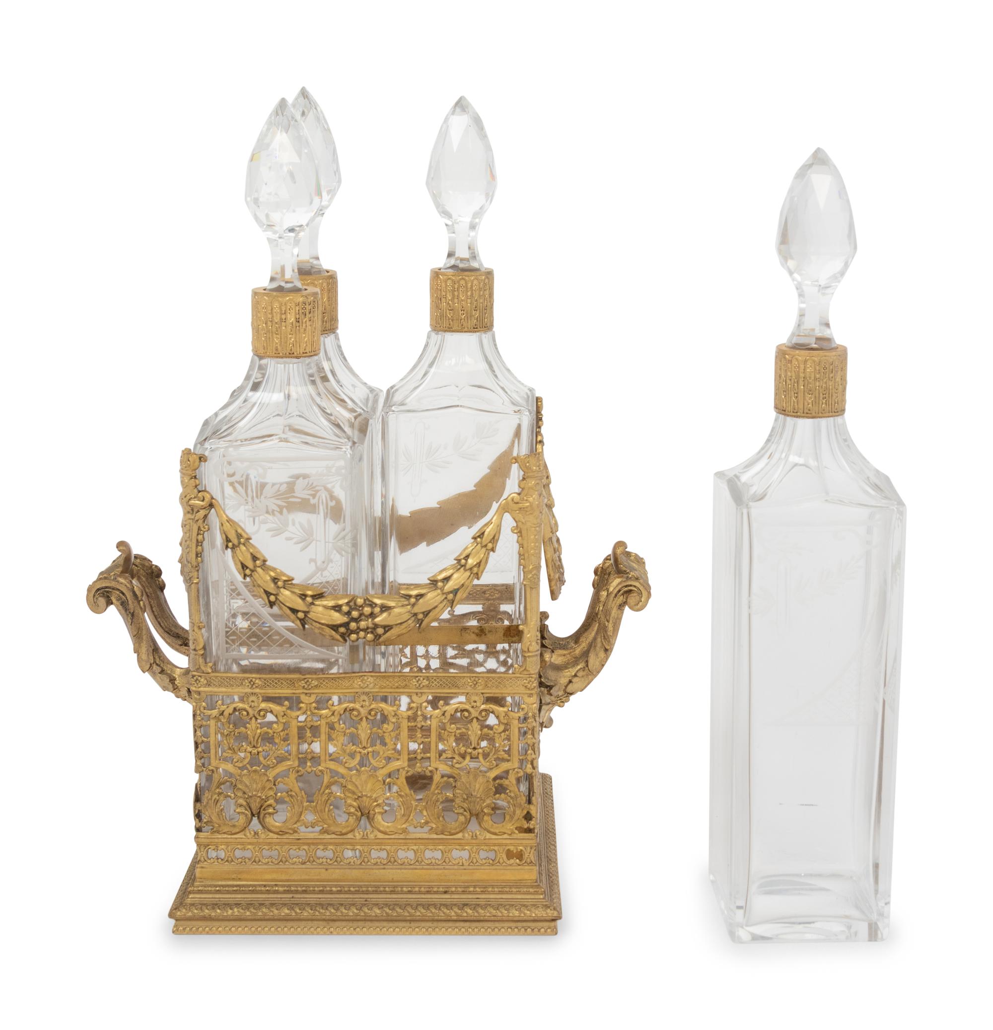 A French Gilt Metal and Glass Four-Bottle Decanter Caddy