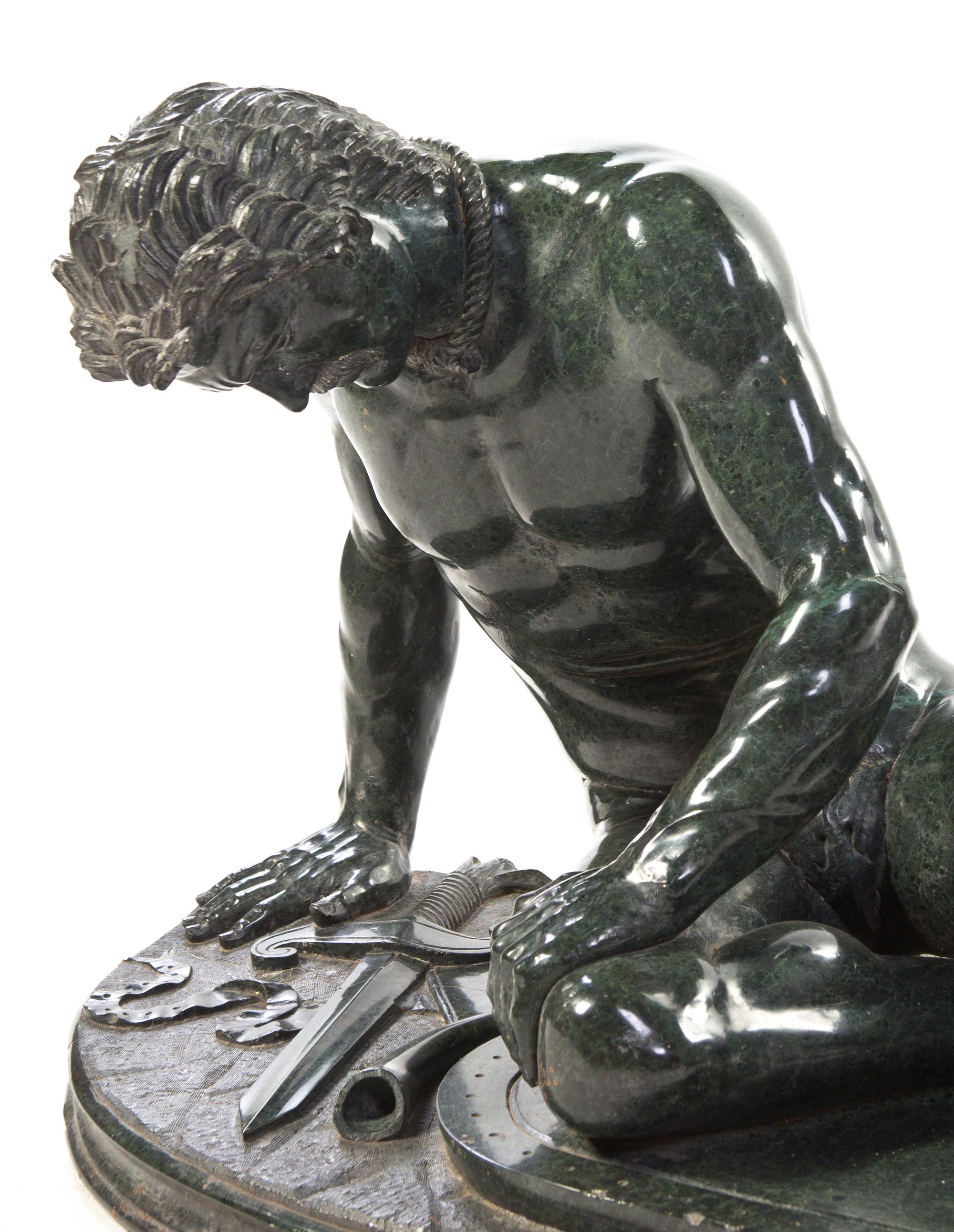 A Continental Carved Marble Figure, after the Antique, Width overall 41 inches.