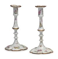 A Pair of Battersea Enamel Candlesticks