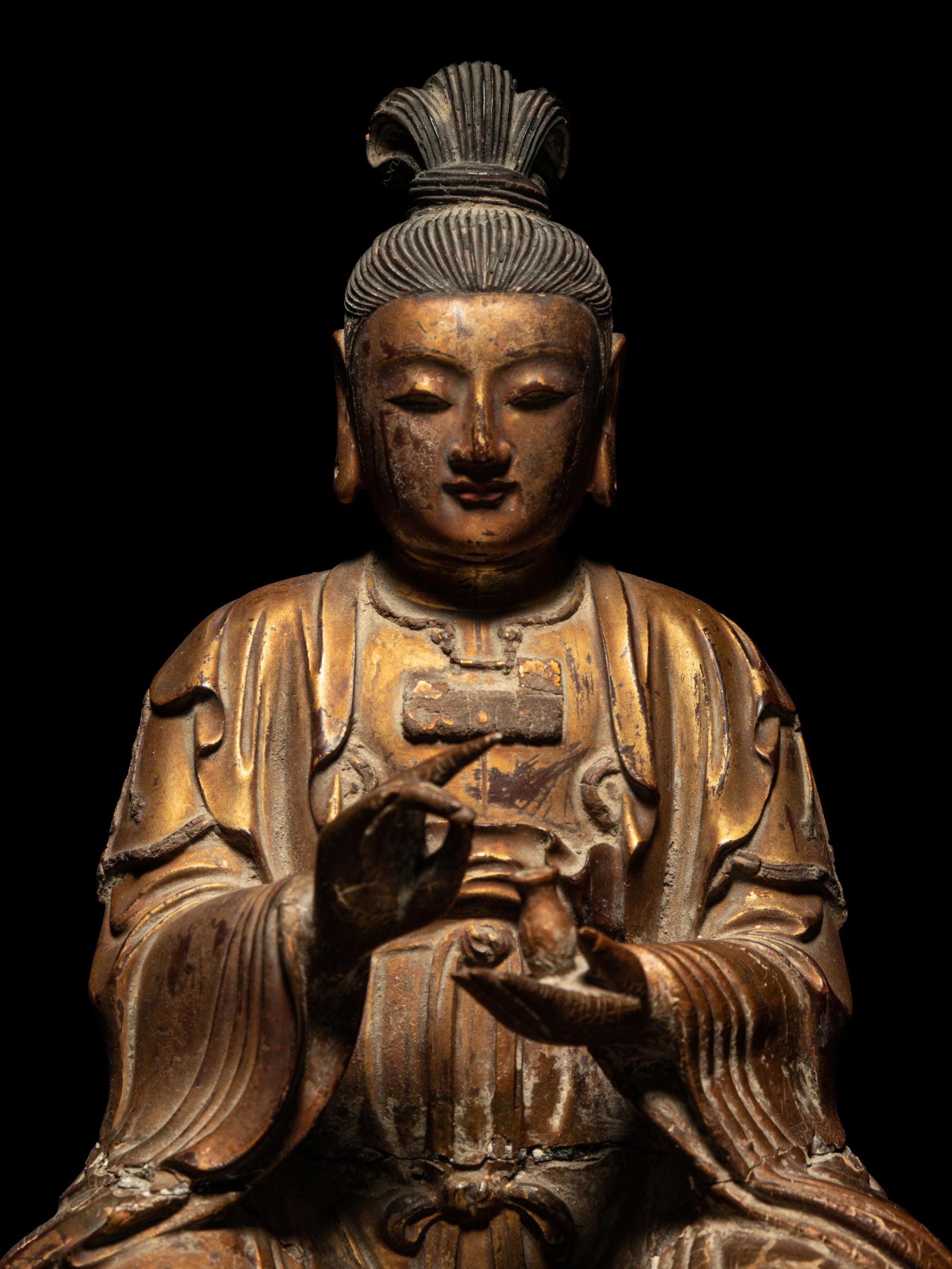 A Gilt Wood Figure of Seated Guanyin