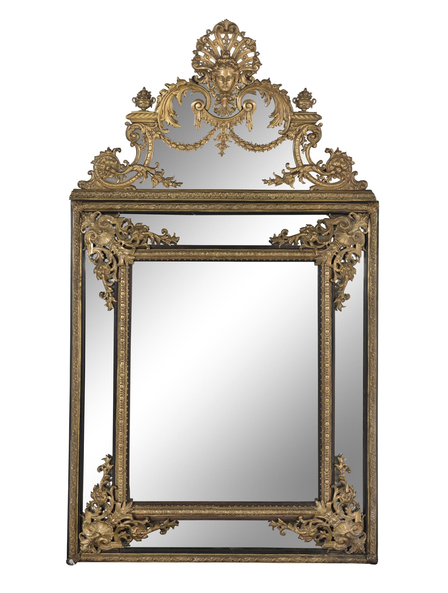 A Louis XIV Style Gilt Bronze Mounted and Ebonized Mirror