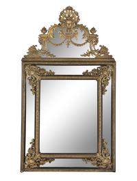 A Louis XIV Style Gilt Bronze Mounted and Ebonized Mirror