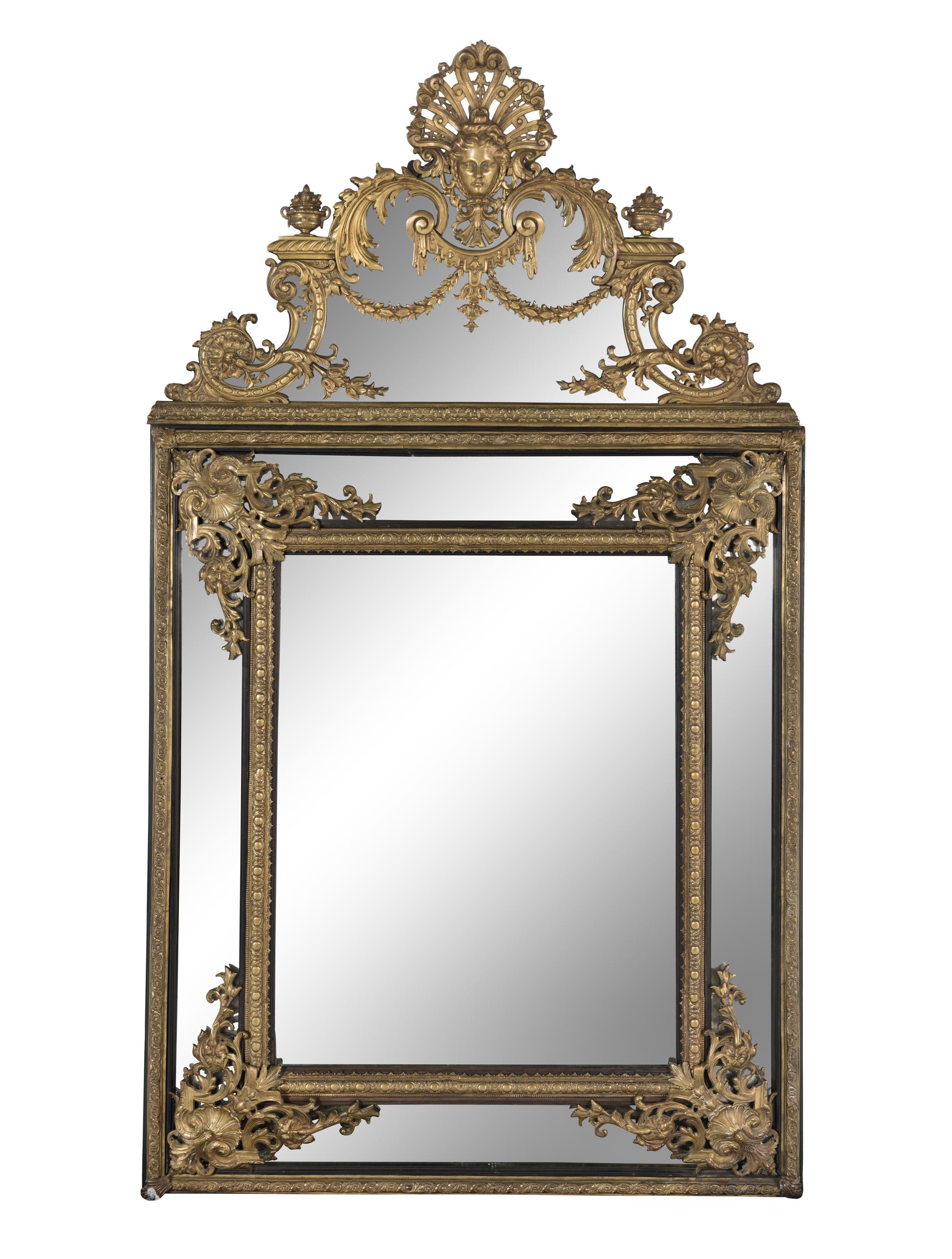 A Louis XIV Style Gilt Bronze Mounted and Ebonized Mirror