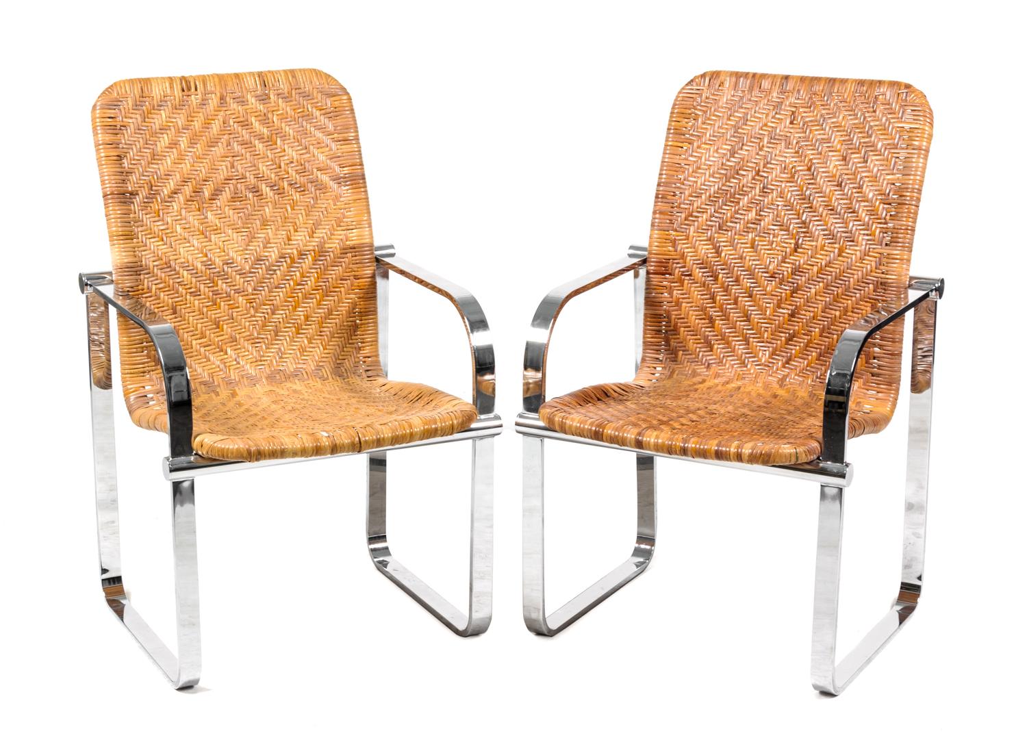A Pair of Chrome and Rattan Armchairs Height 36 3/4 x width 23 x depth 25 inches.