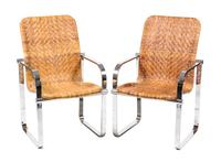 A Pair of Chrome and Rattan Armchairs Height 36 3/4 x width 23 x depth 25 inches.