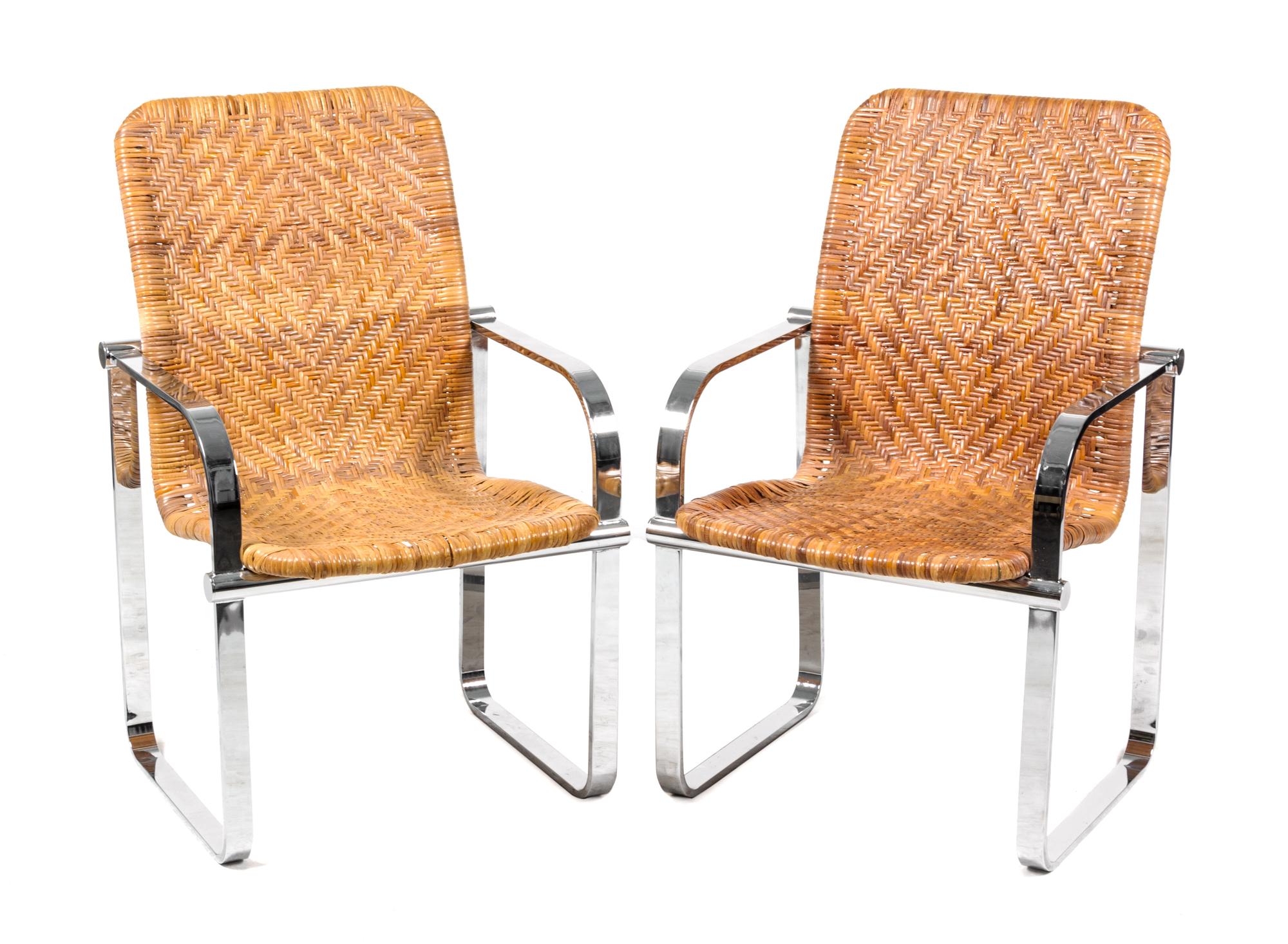 A Pair of Chrome and Rattan Armchairs Height 36 3/4 x width 23 x depth 25 inches.