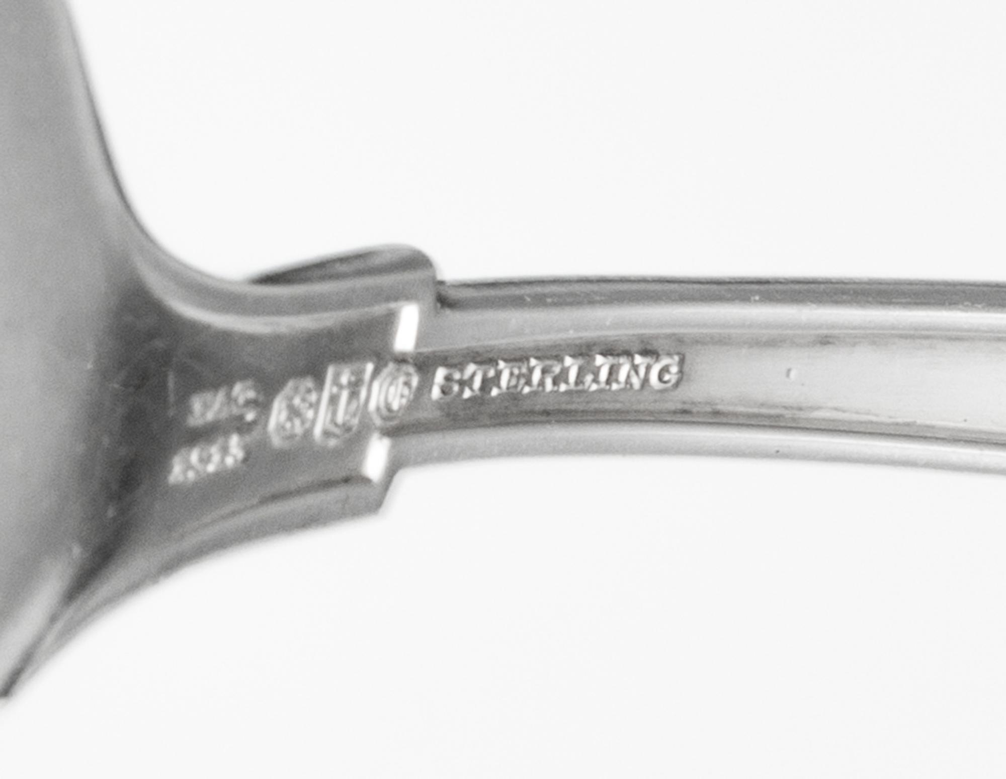 An American Silver Flatware Service, Gorham Mfg. Co., Providence, RI, Etruscan pattern, comprising: 11 dinner knives 11 dinner forks 12