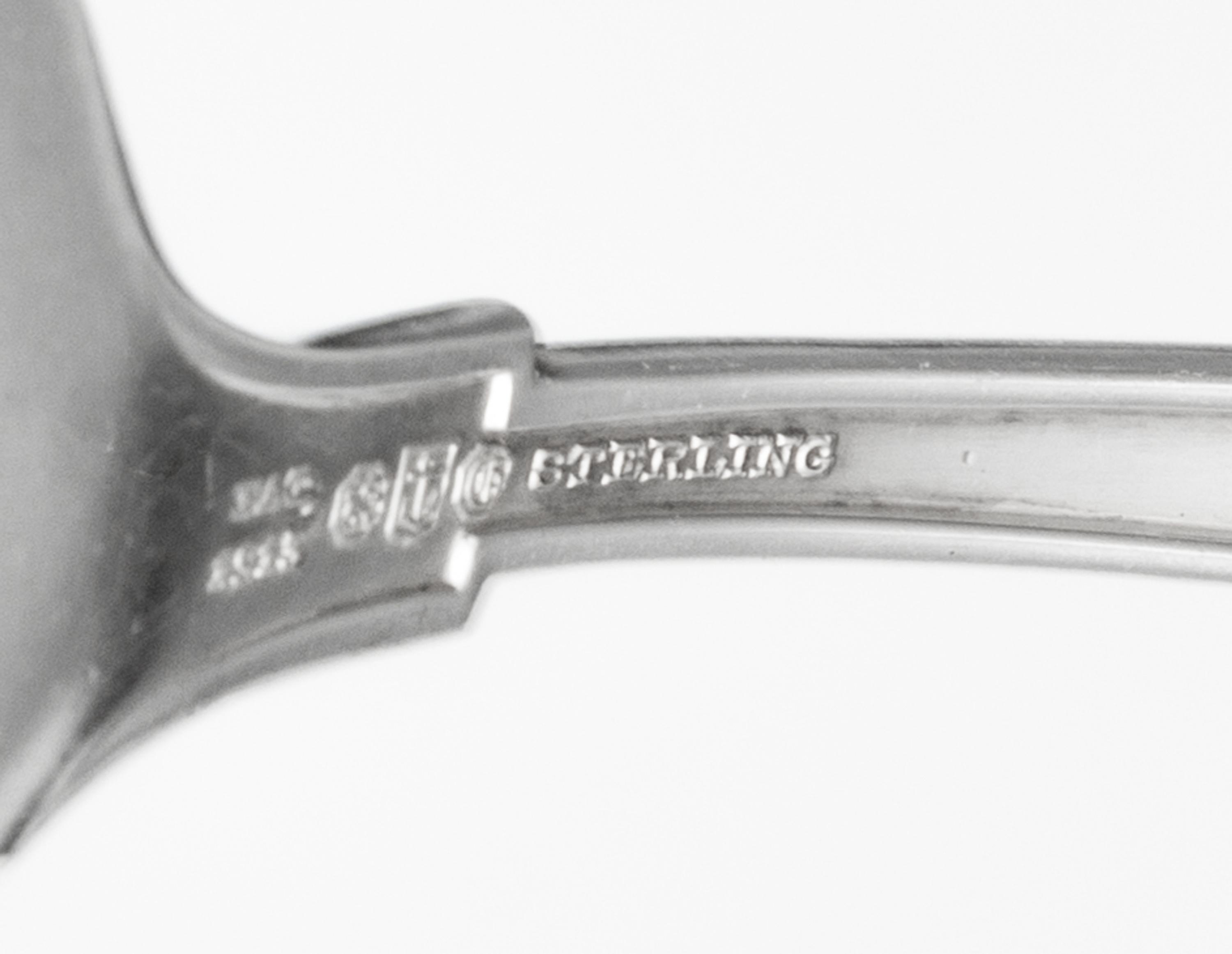 An American Silver Flatware Service, Gorham Mfg. Co., Providence, RI, Etruscan pattern, comprising: 11 dinner knives 11 dinner forks 12